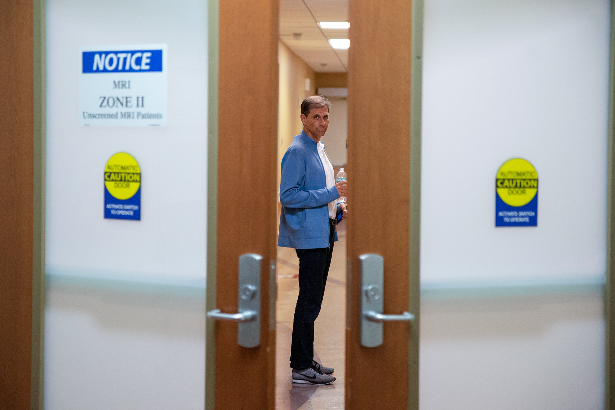  Moments before getting a CT scan, Tendler glances back through the doorway to his aunt, who is accompanying him throughout the visit. Later, a meeting with his physician confirms the results of the CT scan are not good. 