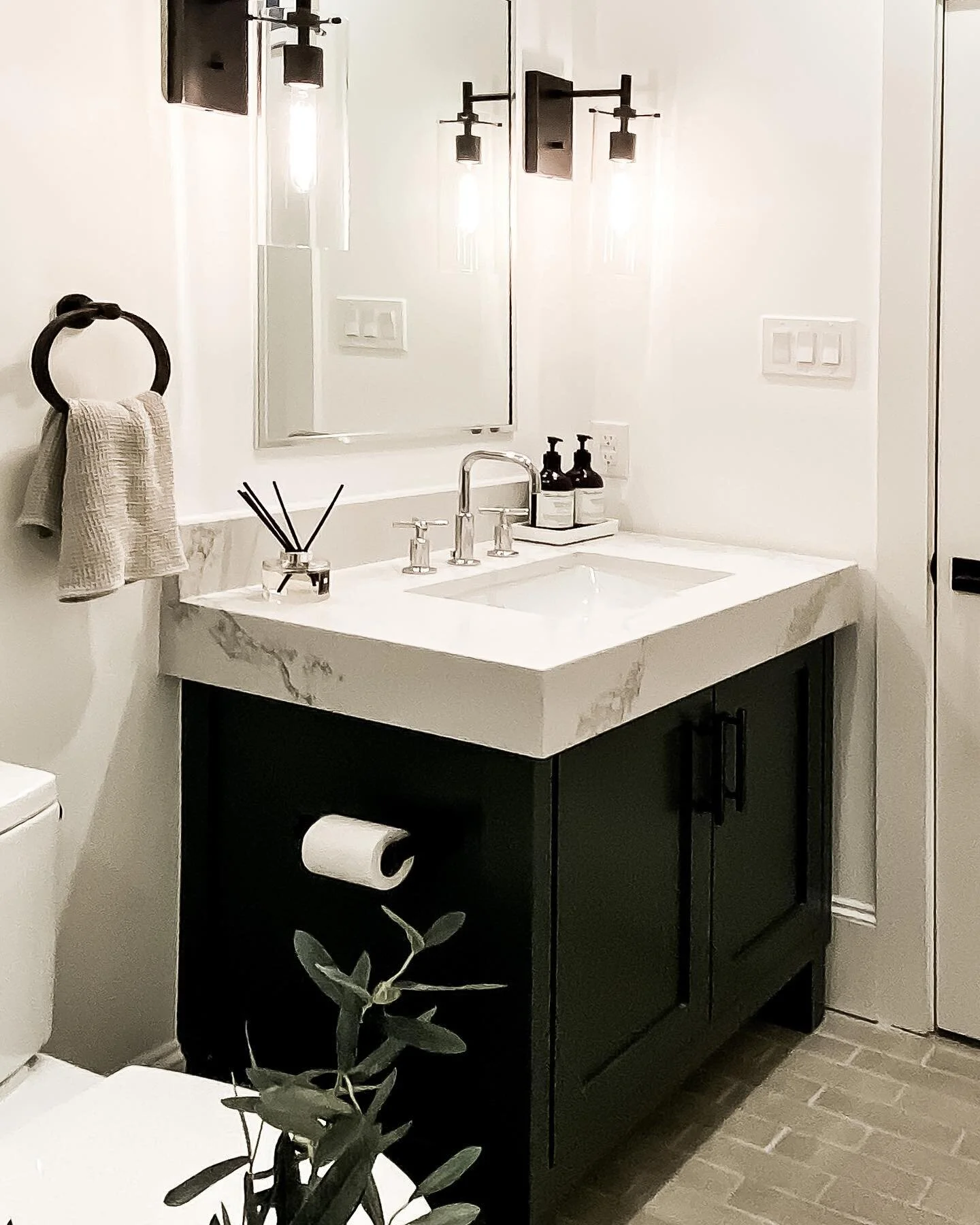 The powder room at the #vickery2020project turned out modern and serene - we love the stunning quartz countertop and mixed metal finishes. The @cletile foundry flats on the floor was the perfect finish. What guest wouldn&rsquo;t love using this room?