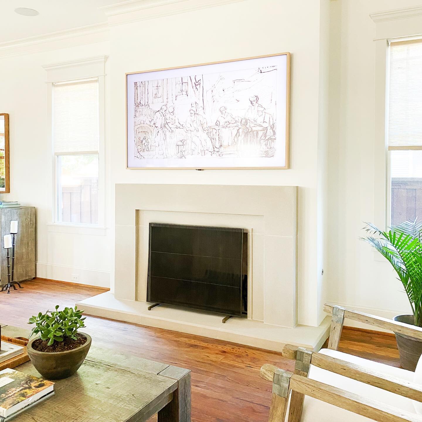 The living room at our #vickery2020project got a major update - we removed the oversized, bulky wood trimmed fireplace surround and installed a custom designed cast stone surround that is modern, chic, and much better sized for the room. We also remo