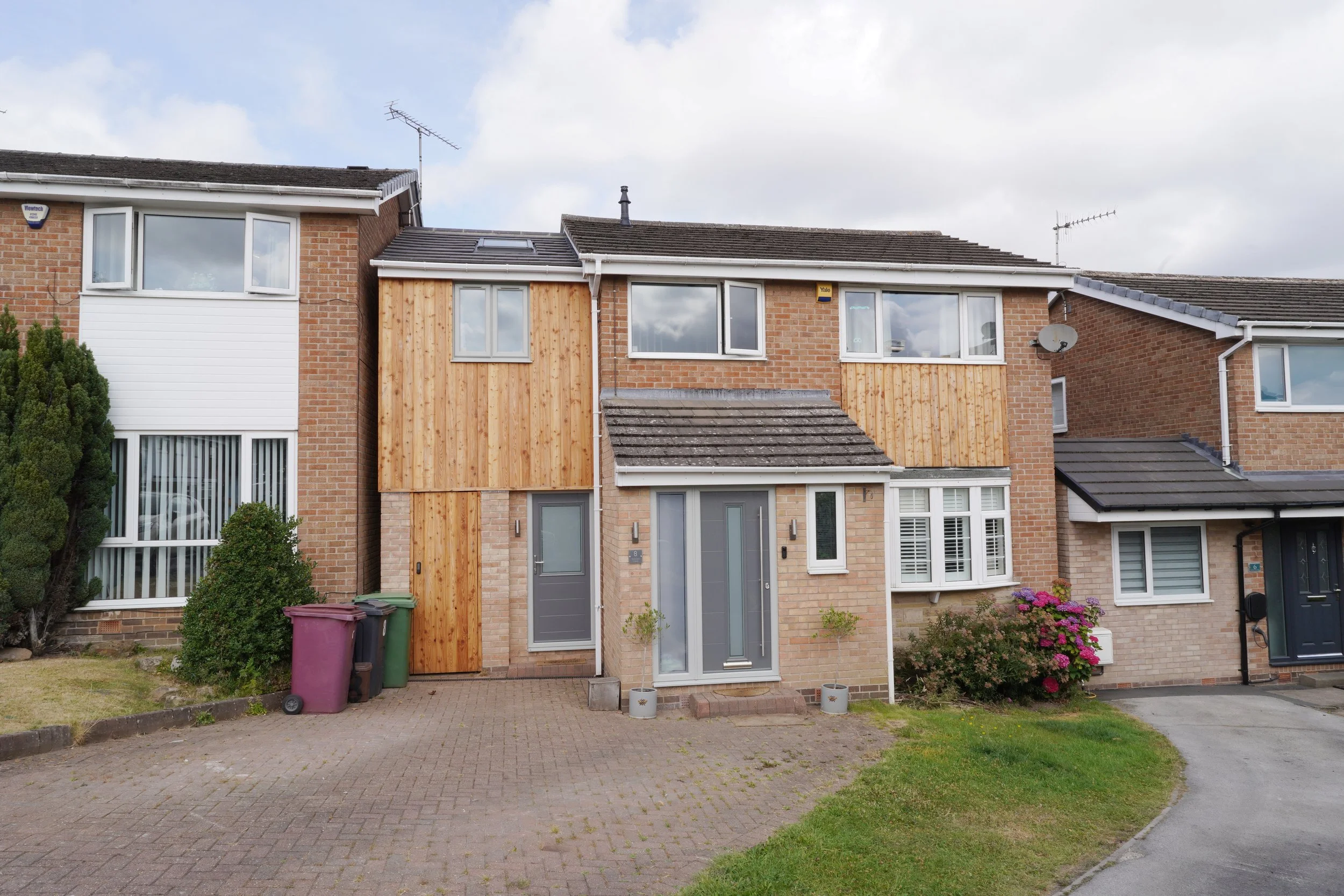 two storey side extension in Dronfield, Sheffield; timber cladding and brick finish
