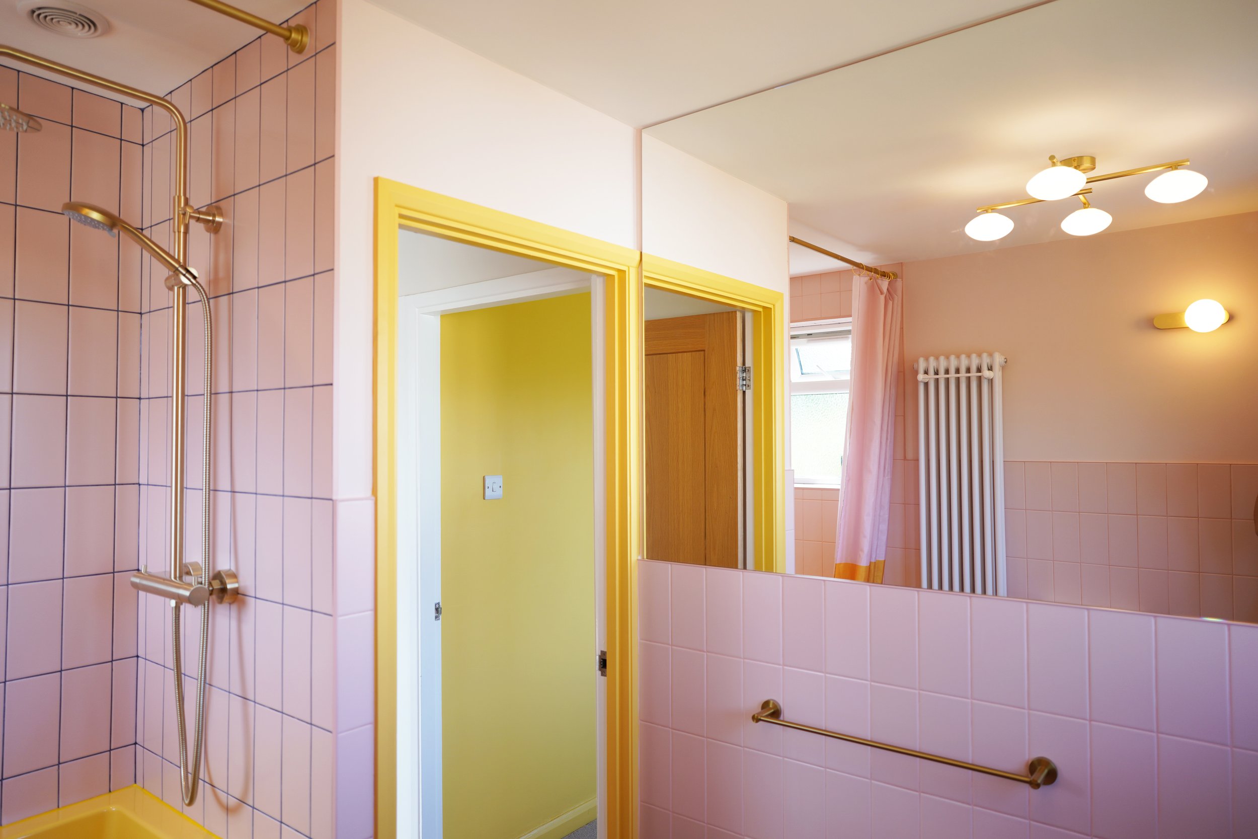 bathroom renovation Sheffield, pink bathroom, full width wall mirror in bathroom
