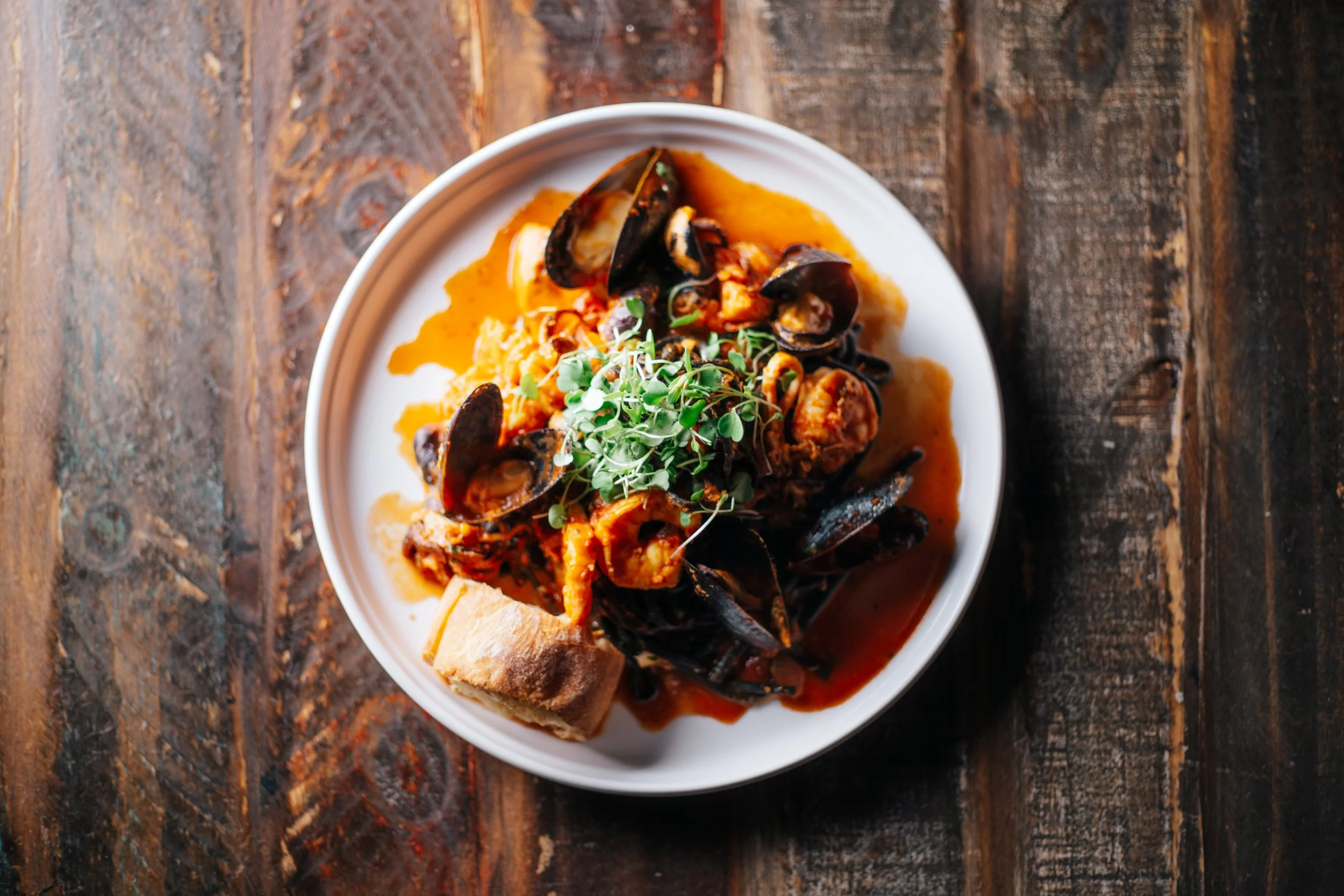 top down seafood plate with mussels, clams, shrimp, and octopus (Copy)