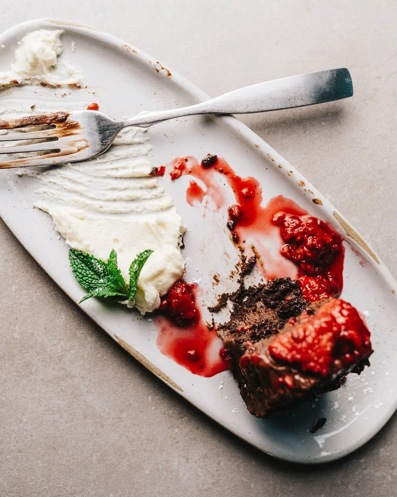 chocolate cake with raspberry reduction and whipped cream (Copy)