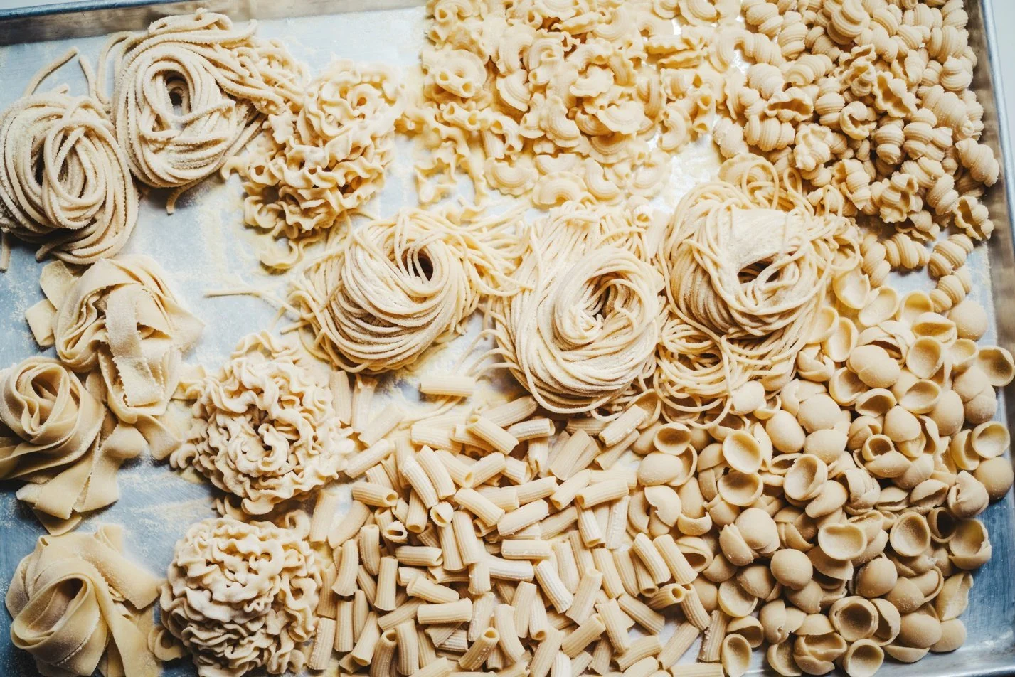 array of fresh hand-made pasta on a tray (Copy)