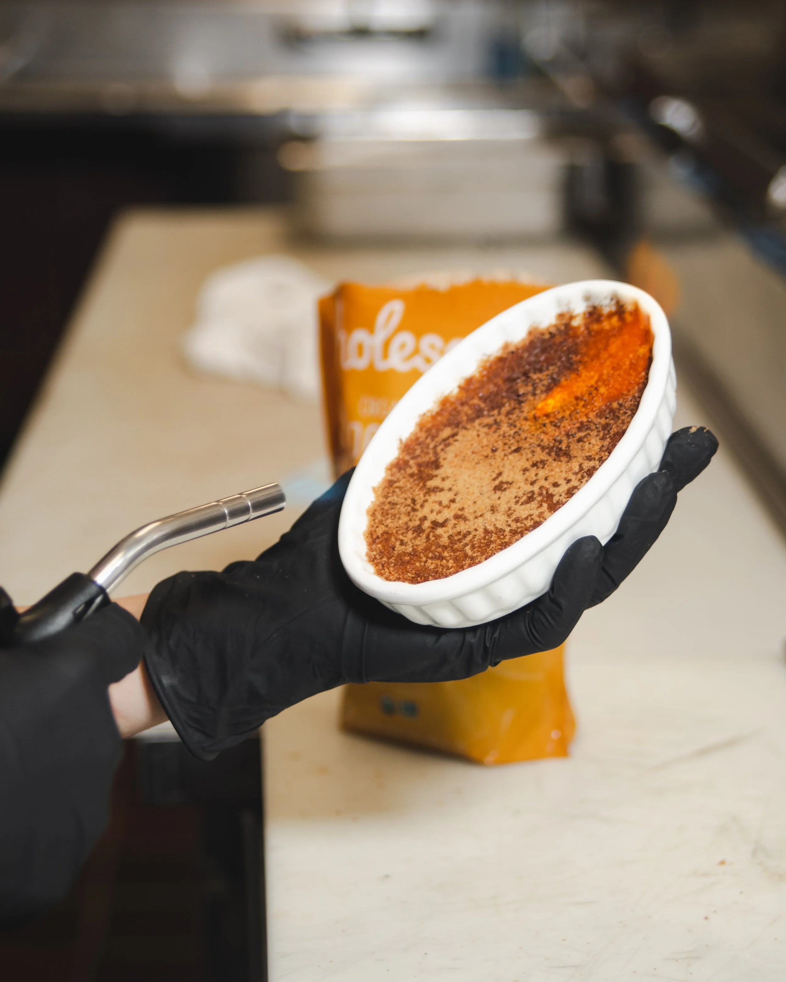 caramelizing the top of a creme brulee (Copy)