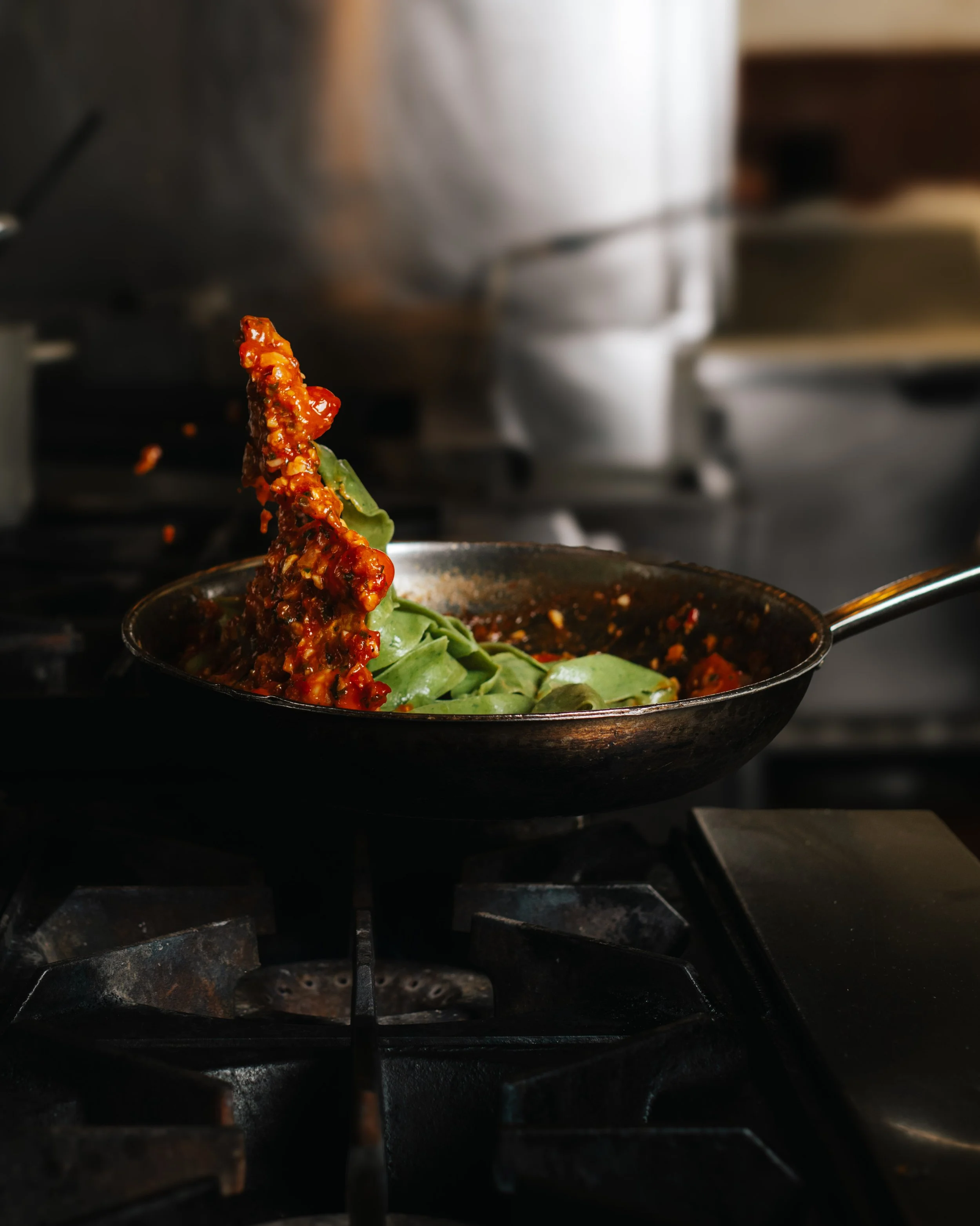 Cooking shrimp pappardelle in a steel pan (Copy)