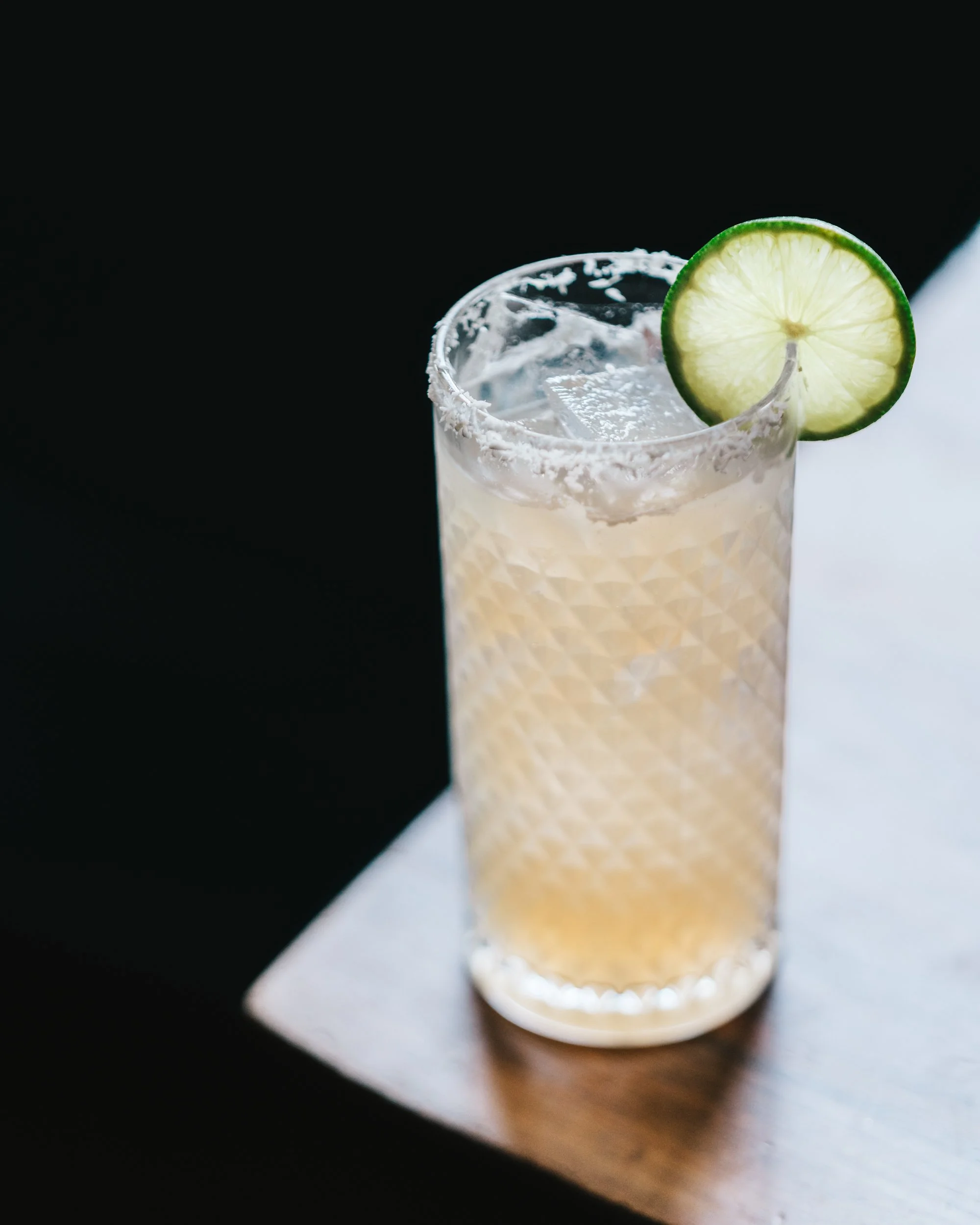 backlit margarita with lime wedge