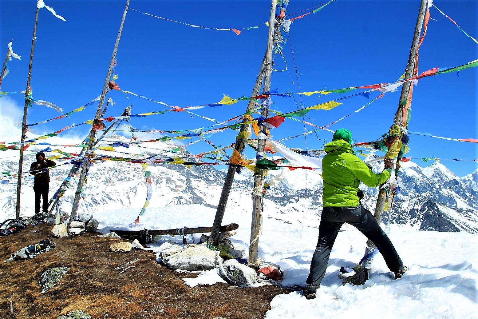 Hanging prayer flags on top of Tserko Ri