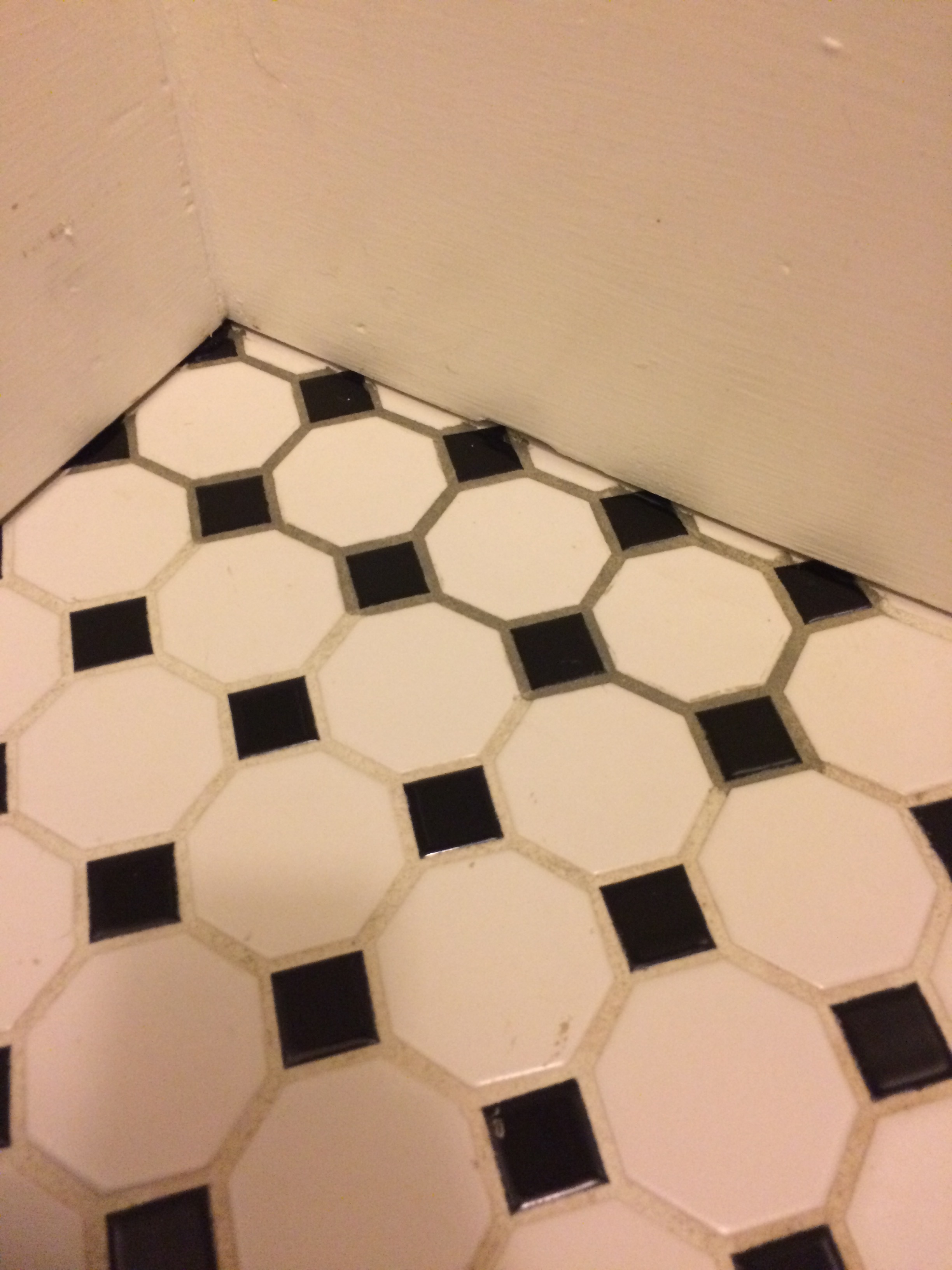 Here you can see the difference between the old white grout, and the grout that has been treated with PolyBlend Grout Renew. 