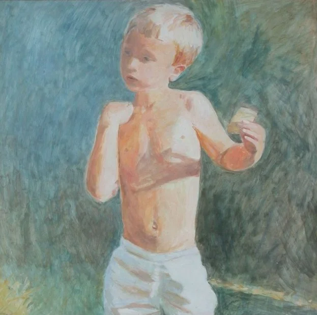 Joseph holding a biscuit