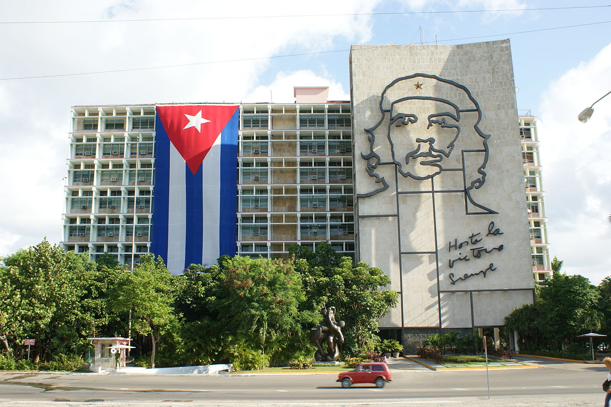 1200px-Ministry_of_the_Interior_of_Cuba_with_flag.jpg