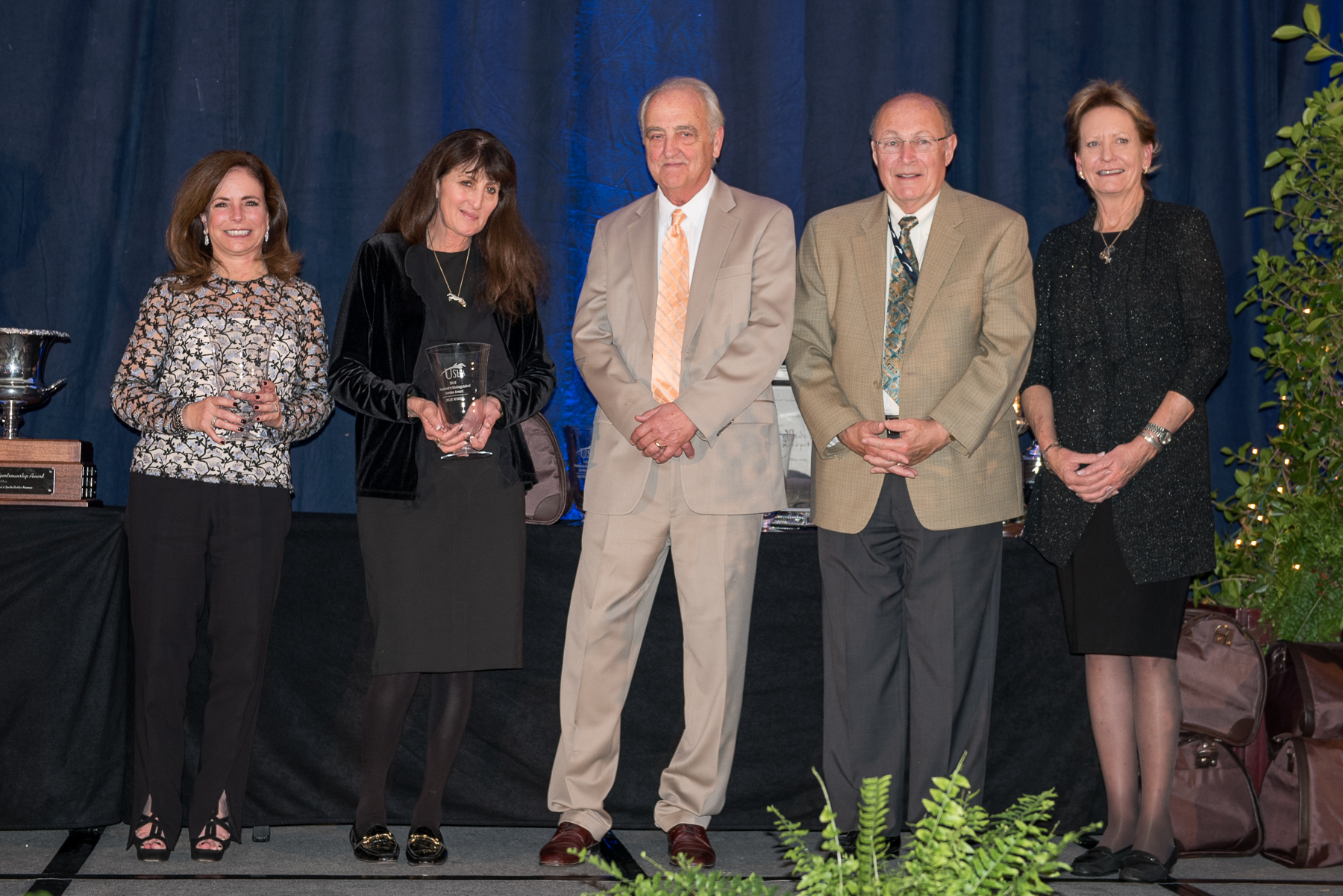 Julie Winkel, second from left, received a USHJA President's Distinguished Service Award during the USHJA Annual Meeting. She's pictured with fellow award winners, from left, Cheryl Rubenstein, Joe Dotoli, Howard Pike and Kathy Meyer.