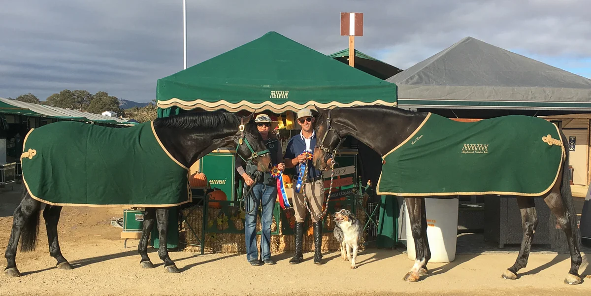 Good To Know and Julie Winkel, left, and Onyx with Andrew Jayne celebrate their championships.