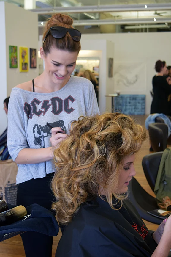 Aspen Johnson creates bouncy curls at Alter EGO Hair Salon in downtown Raleigh.