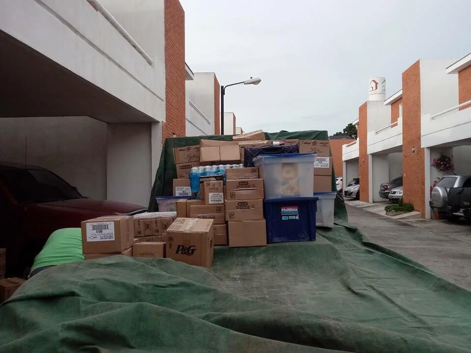 packing the truck with the supplies and materials to take. 