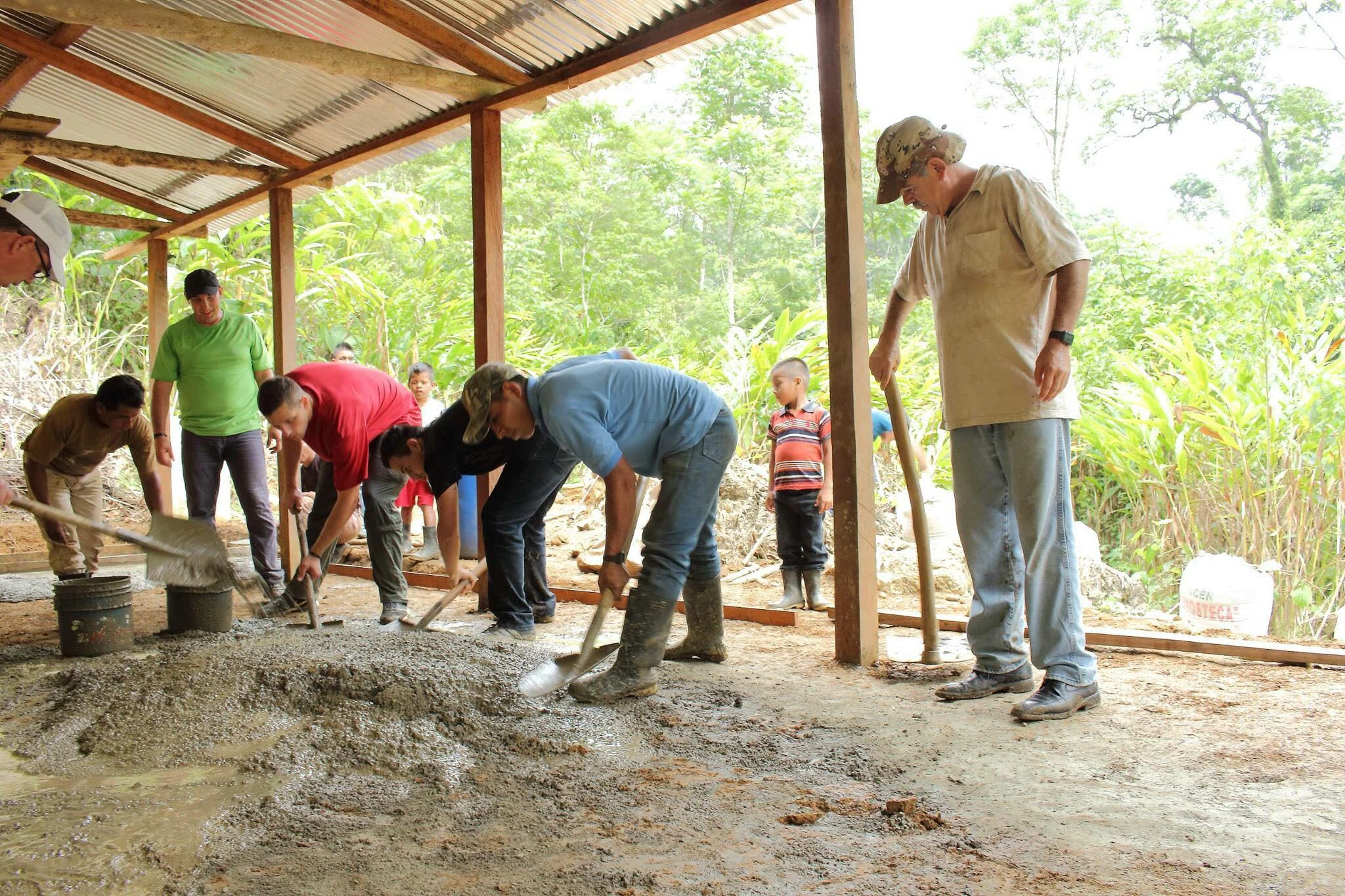 The volunteers along with members of the village hard at work, to build the school's foundation. 