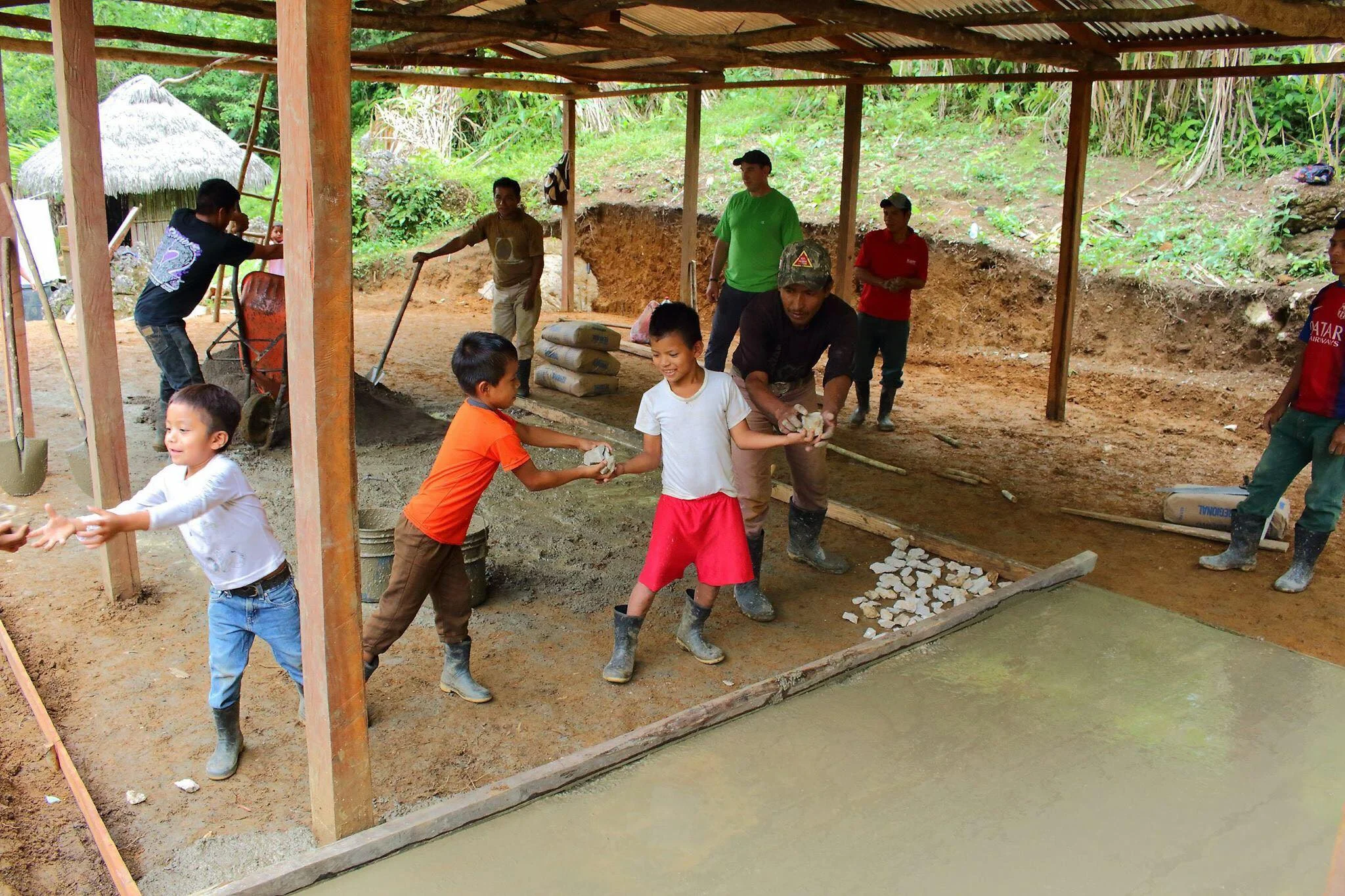 Even some of the students wanted to join in the cement mixing.