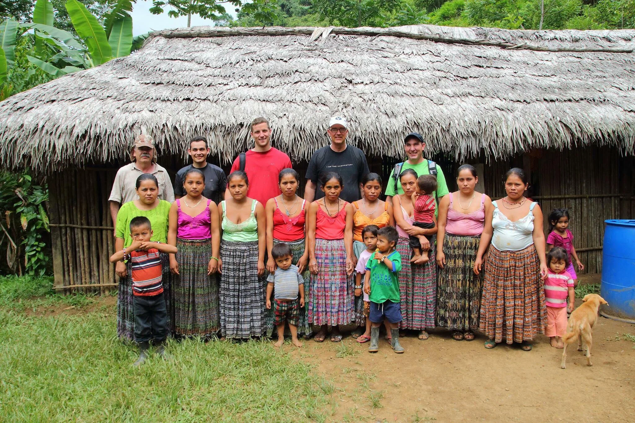 Our volunteers in front of the old school house with a group of mothers from the village. 