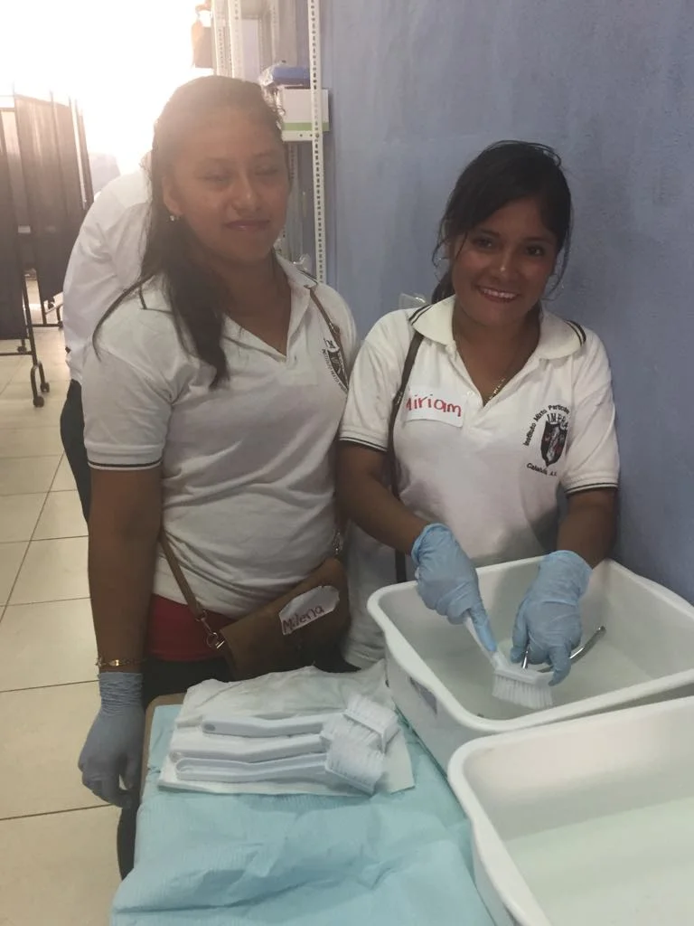 The sterilizing station where instruments are being scrubbed with germicide and other chemicals.