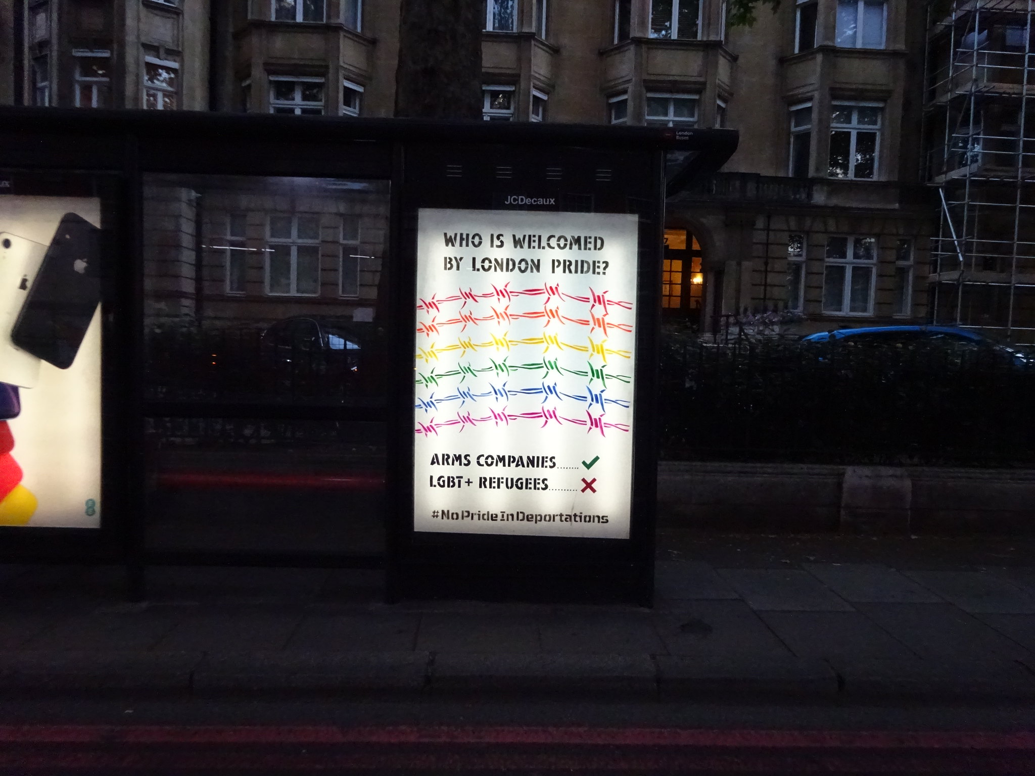 Bus stop adhack by Lesbians and Gays Support the Migrants and Protest Stencil protesting the exclusion of LGBT+ asylum seekers, homeless people and community groups from Pride in London5