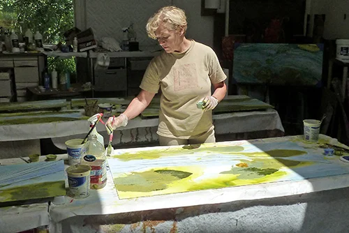 Vicki Junkwright color washing panels in the studio