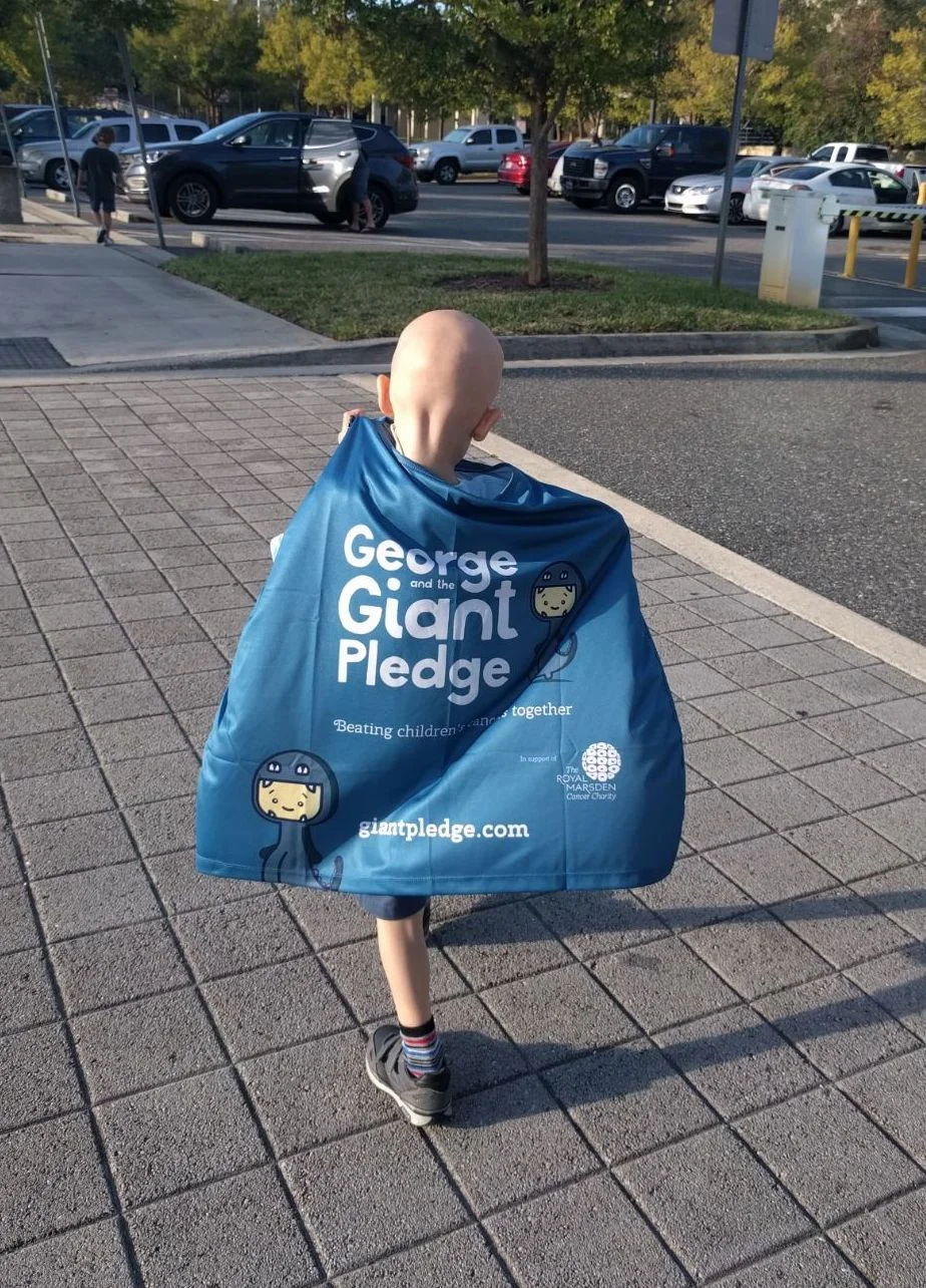 George-rocking-his-cape-on-last-day-of-30-rounds-of-Proton-Therapy-in-Jacksonville-Florida.jpg
