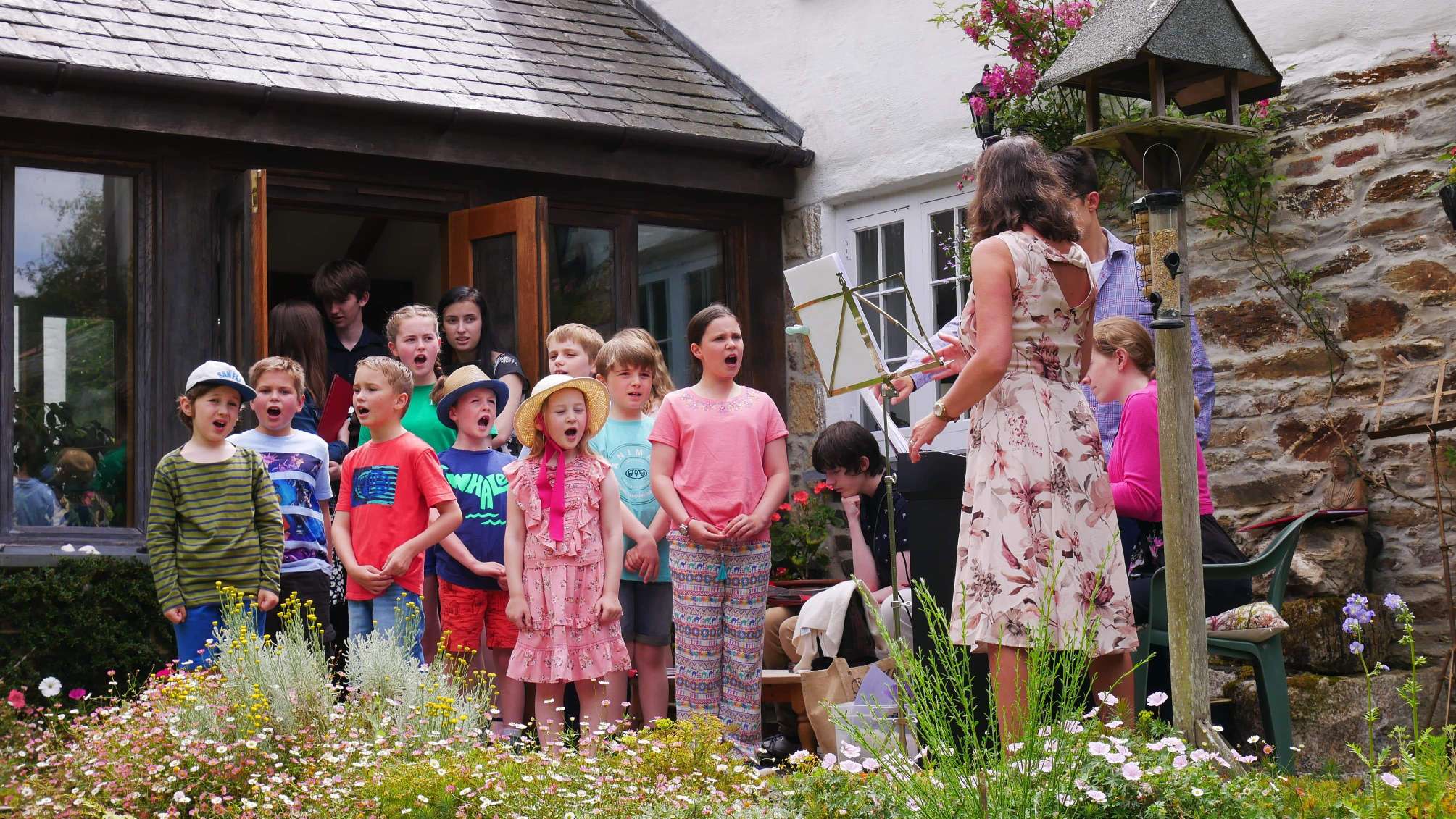 Cornwall Junior Choir in performance at Brackenwoods Open Garden in June under the direction of their then director, Christine Judge.