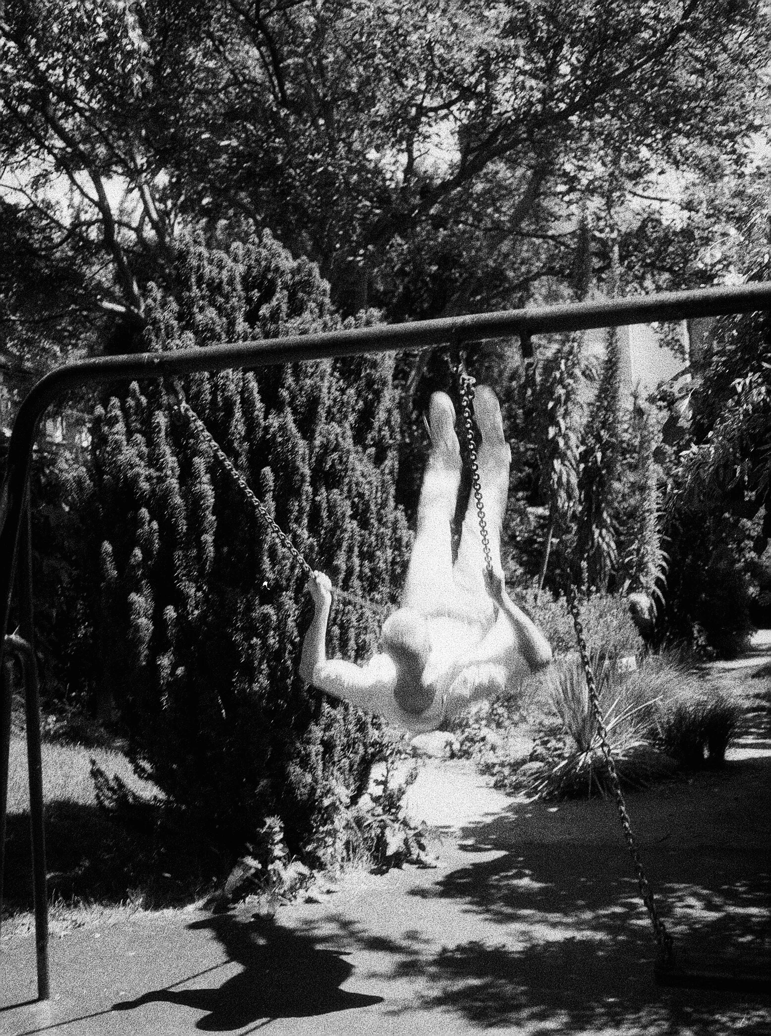  Ben on a swing, where he looks like a fallen angel; London, UK. June, 2021.  