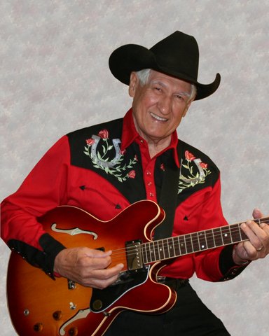 Les Gilliam pickin’ away at his guitar.