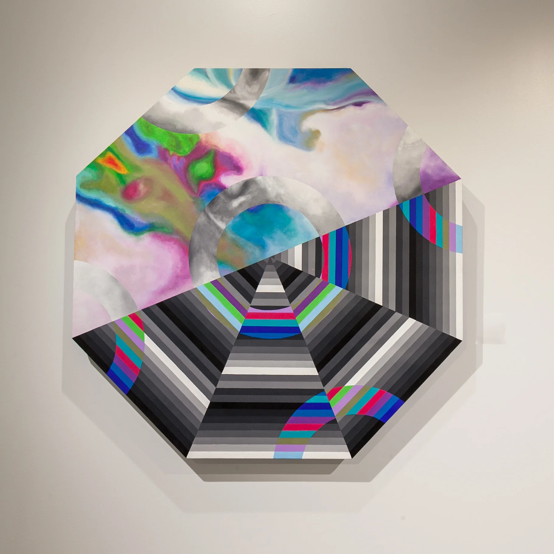 Paige Ellens (Memphis, TN) Octagonal Prism , 2019 Medium: Acrylic and ink on canvas Dimensions: 56x56x3.5 inches “In the last year or two, I have become obsessed with line work and using repetitive patterns. I also love experimenting with colors that work to make some sort of optical illusion. In this piece, I worked with a zoomed in photograph of an iridescent bag as a reference for my background. Overlaid, I have line work that mimics the octagonal shape. It can be seen from afar because of its size, yet up close even more can be discovered.” – Paige Ellens