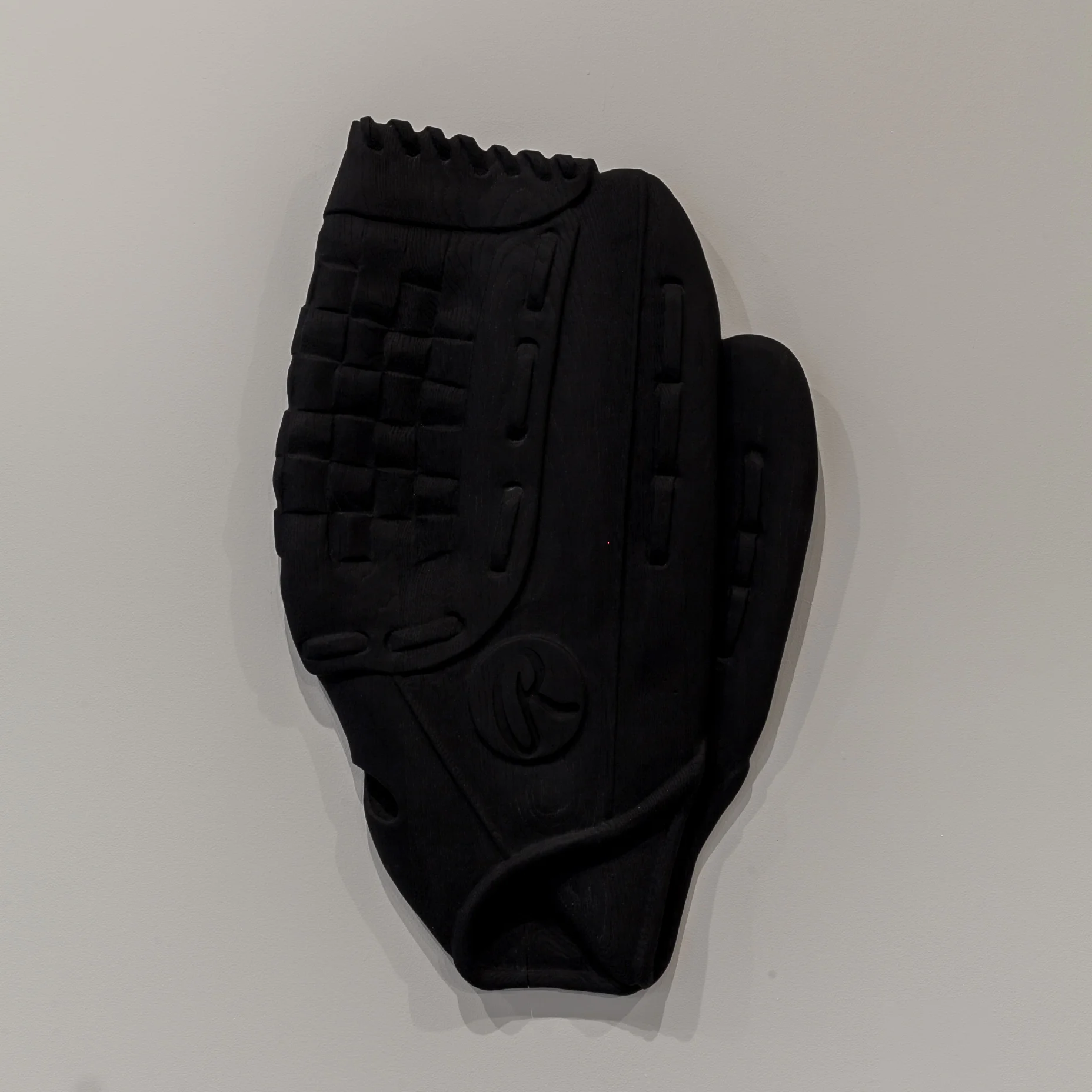 Raymond Padron (Chattanooga, TN) Ball Glove , 2018 Medium: Oxidized white oak relief carving Dimensions: 36x24x2 inches “ Ball Glove is from a series of relief wood carvings I began in 2017. Each of these works is enlarged in scale, yet collapsed against the wall. Referencing the body and its absence, each work is tied to a person whom I've considered a mentor.” – Raymond Padron