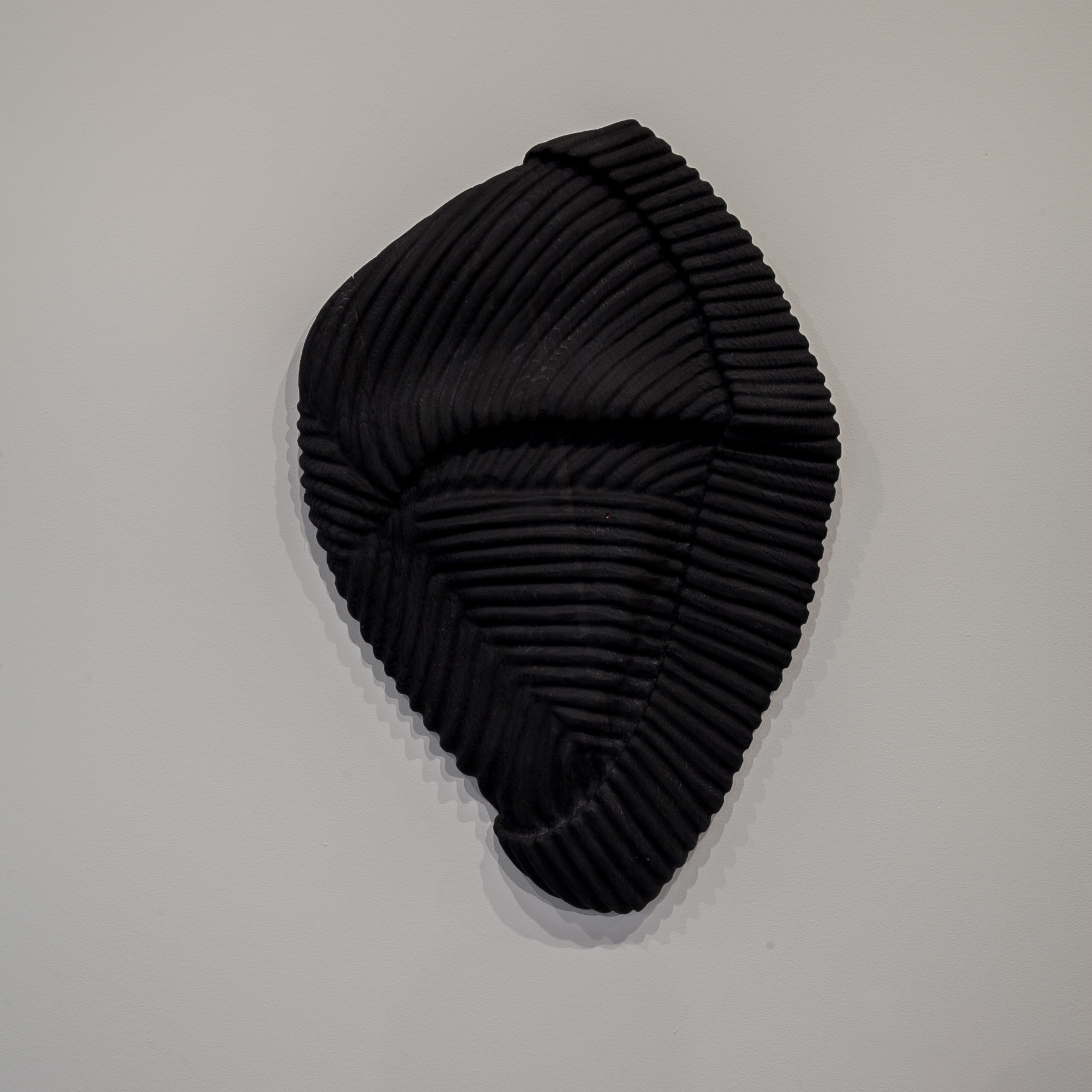 Raymond Padron (Chattanooga, TN) The Watchman , 2018 Medium: Oxidized white oak relief carving Dimensions: 31x21x2 inches “ The Watchman is from a series of relief wood carvings I began in 2017. Each of these works is enlarged in scale, yet collapsed against the wall. Referencing the body and its absence, each work is tied to a person whom I've considered a mentor.” – Raymond Padron