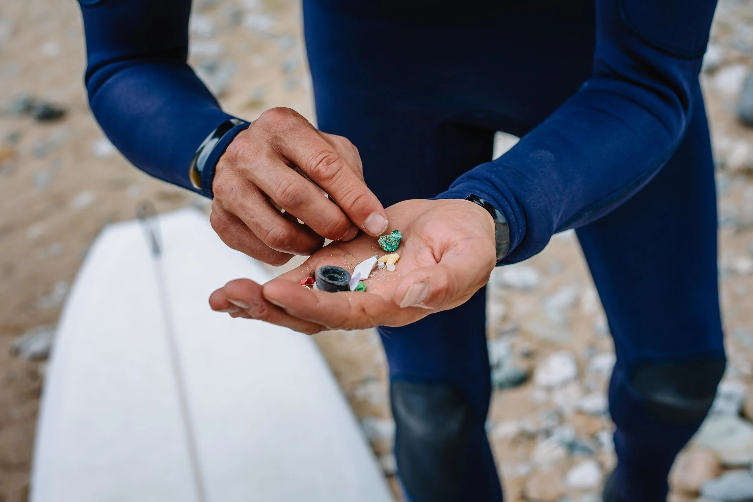 Hugo Tagholm, Chief Executive of Surfers Against Sewage, holds pieces of plastic pollution and other litter picked up at Porthtowan Beach. St Agnes, Cornwall, UK. 29th May 2018.