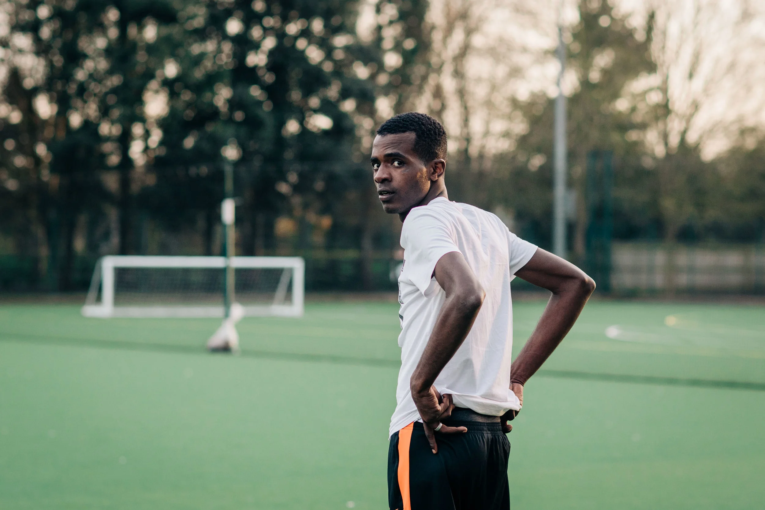 A Nations United FC player stands defending the goal during a training session at Chichester College football pitch. Nations United FC is a football team made up entirely of refugees - set up earlier this year by volunteer group Sanctuary in Chichester. The team has players from around 8 nationalities and was started to help integrate young refugees in West Sussex into the community. Chichester, UK. 7th April 2018.