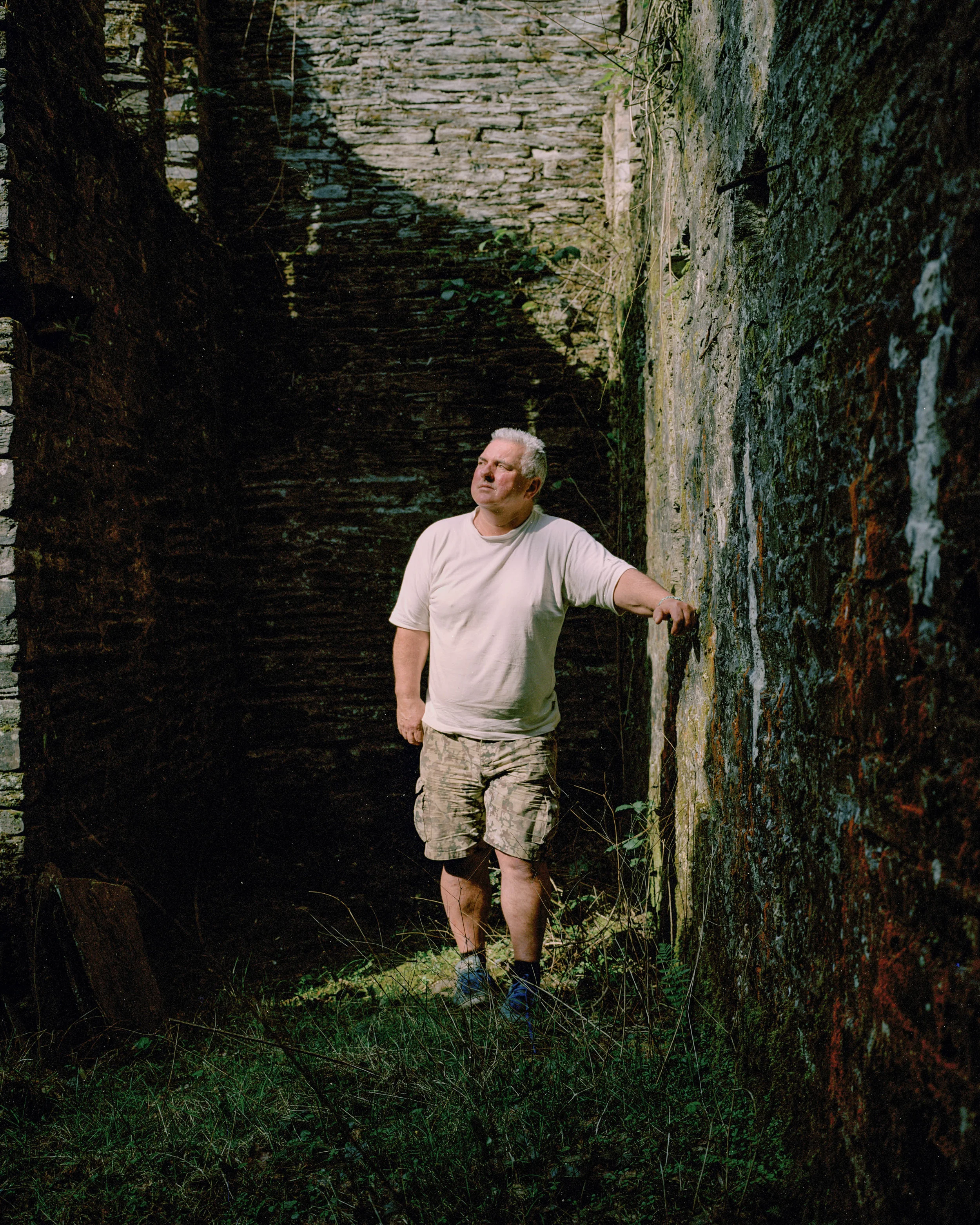 Richard Talling stands in the remains of North Herodsfoot Mine, which operated during the 1800s. Richard lives in the old mine house and works to preserve the historical structures.