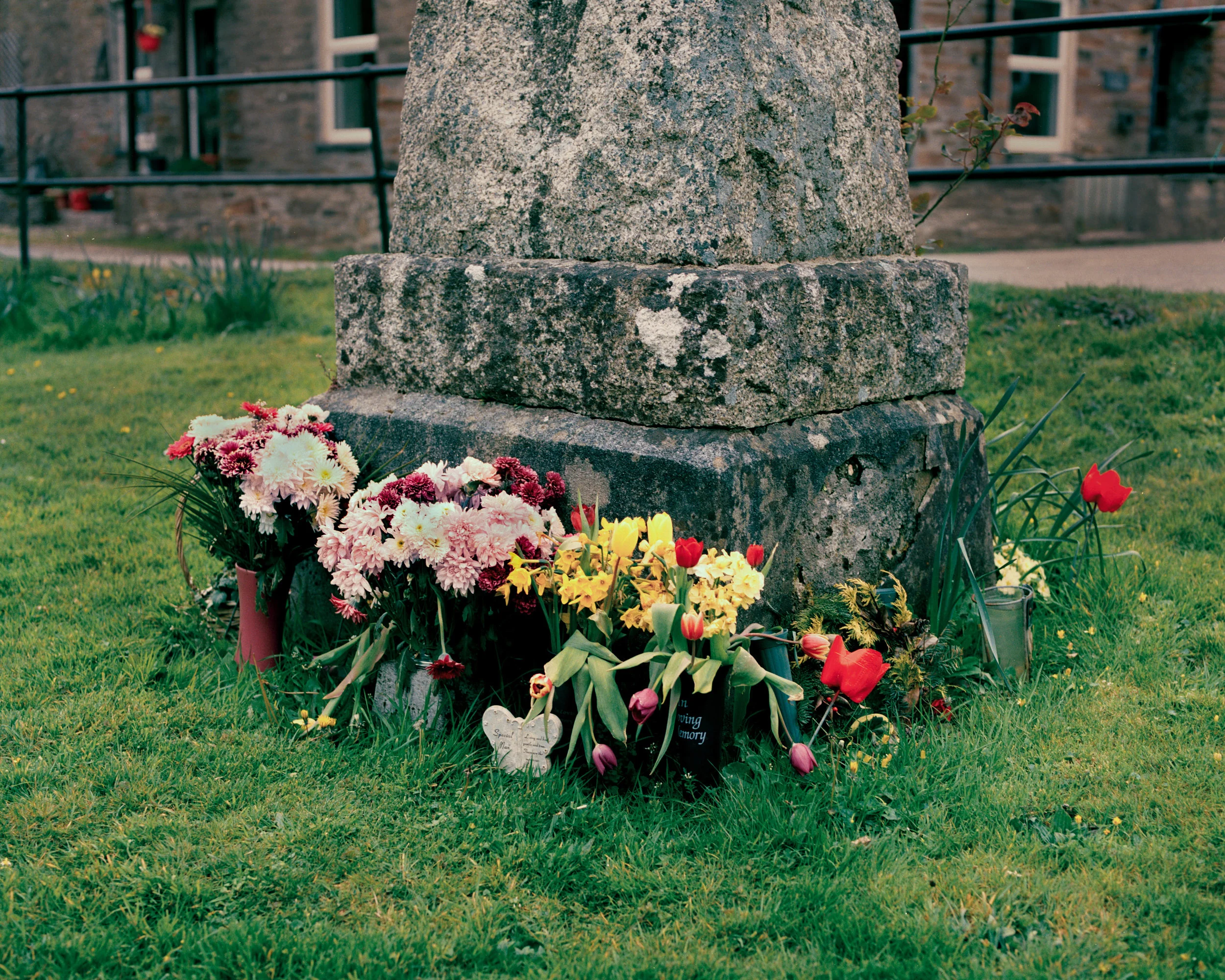 Newly placed flowers around Herodsfoot’s war memorial in the centre of the village.