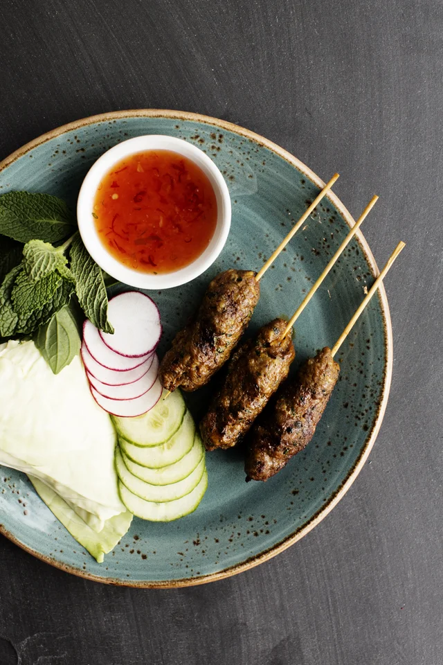 Thai Sausage Skewers gem lettuce, fresh herbs, radish, cucumber, naam jim kai | Young Joni | The Restaurant Project