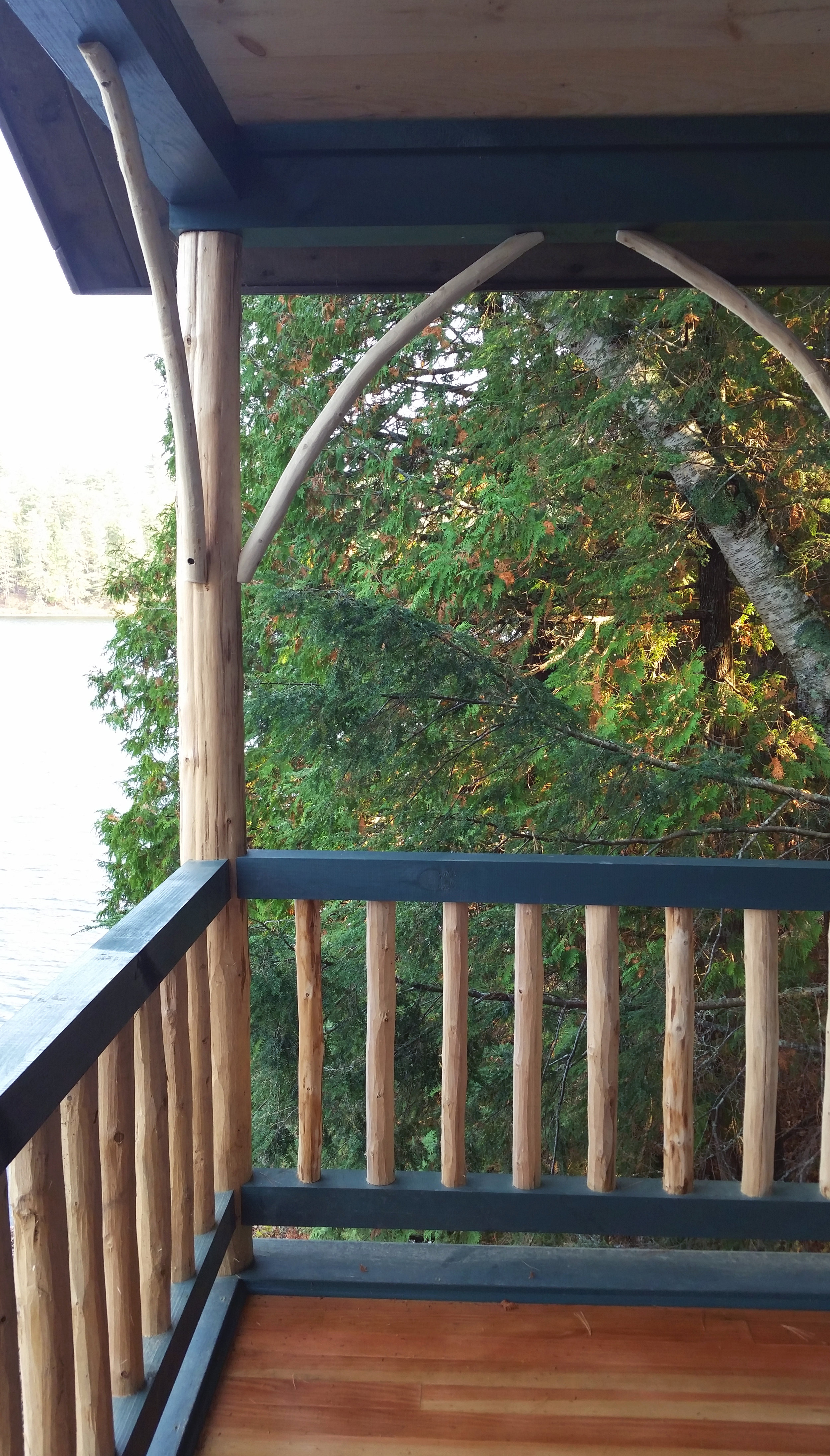 Finished log work on covered porch.
