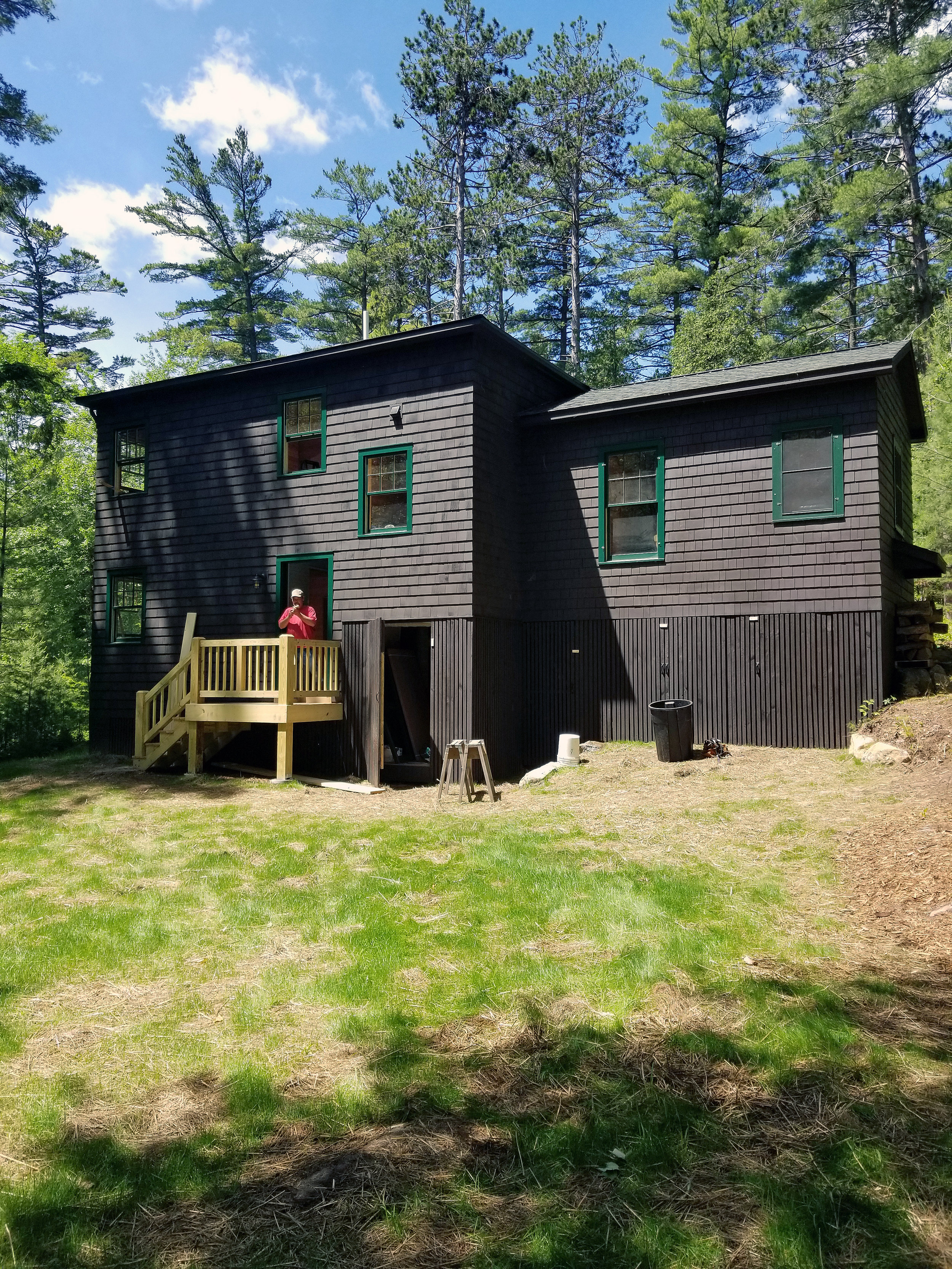 Completed exterior finishes and lawn installation