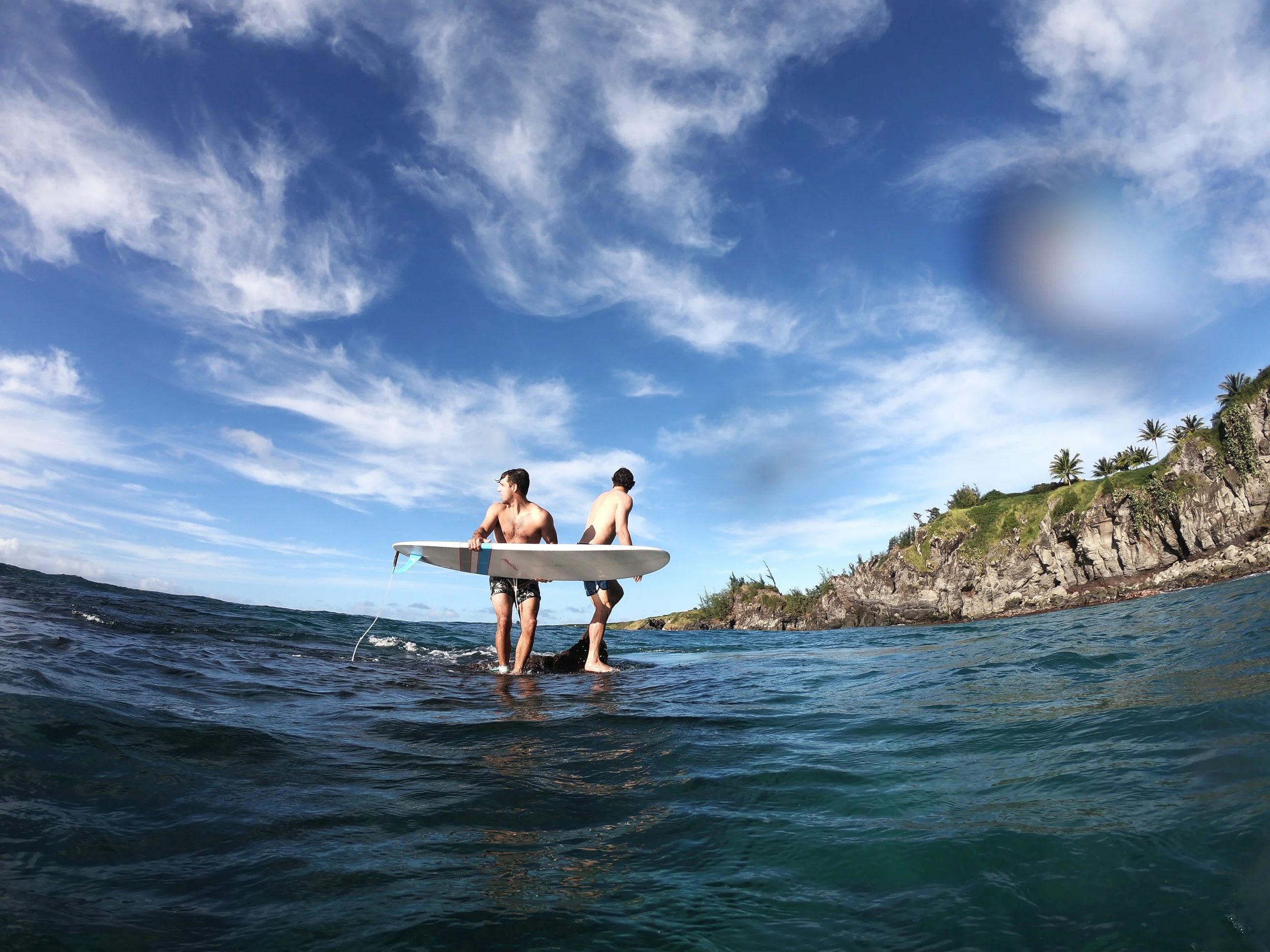 We spent all our afternoons in-between sessions snorkeling and jumping off this rock into waves.