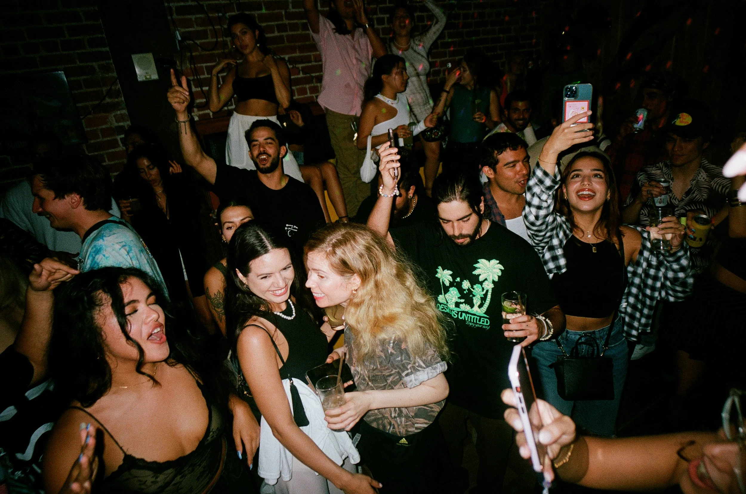 Packed bar during happy hour at Over Under in downtown Miami