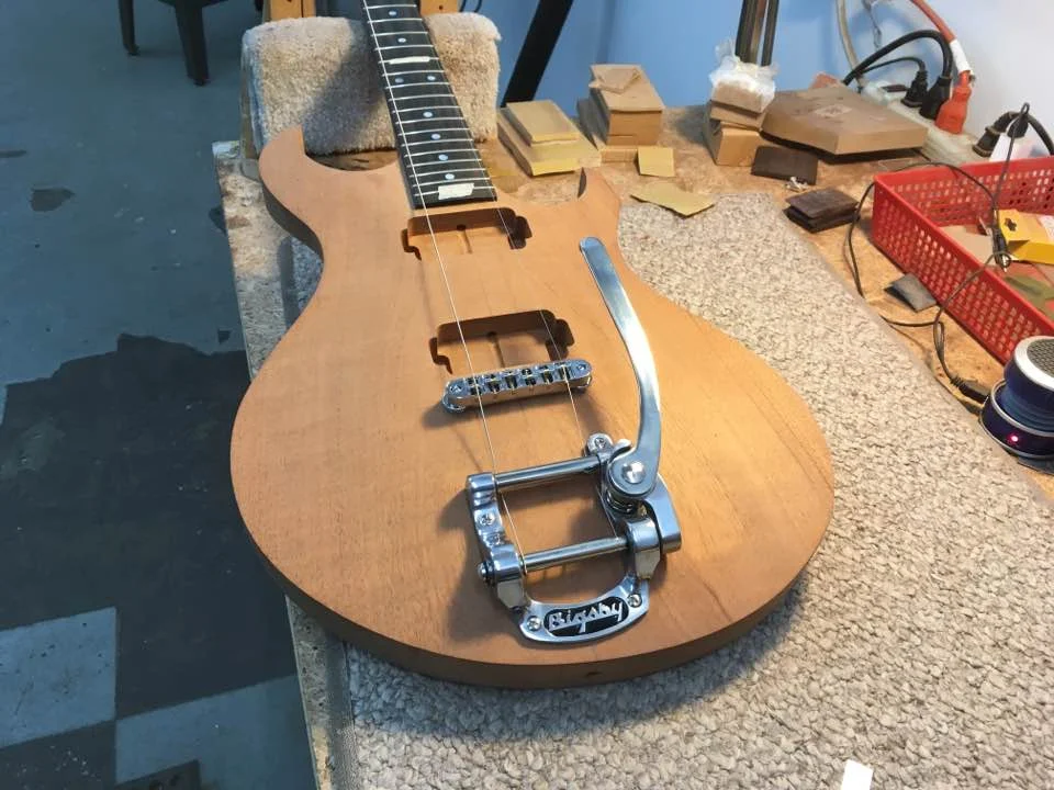 Positioning a Bigsby tremolo tailpiece.