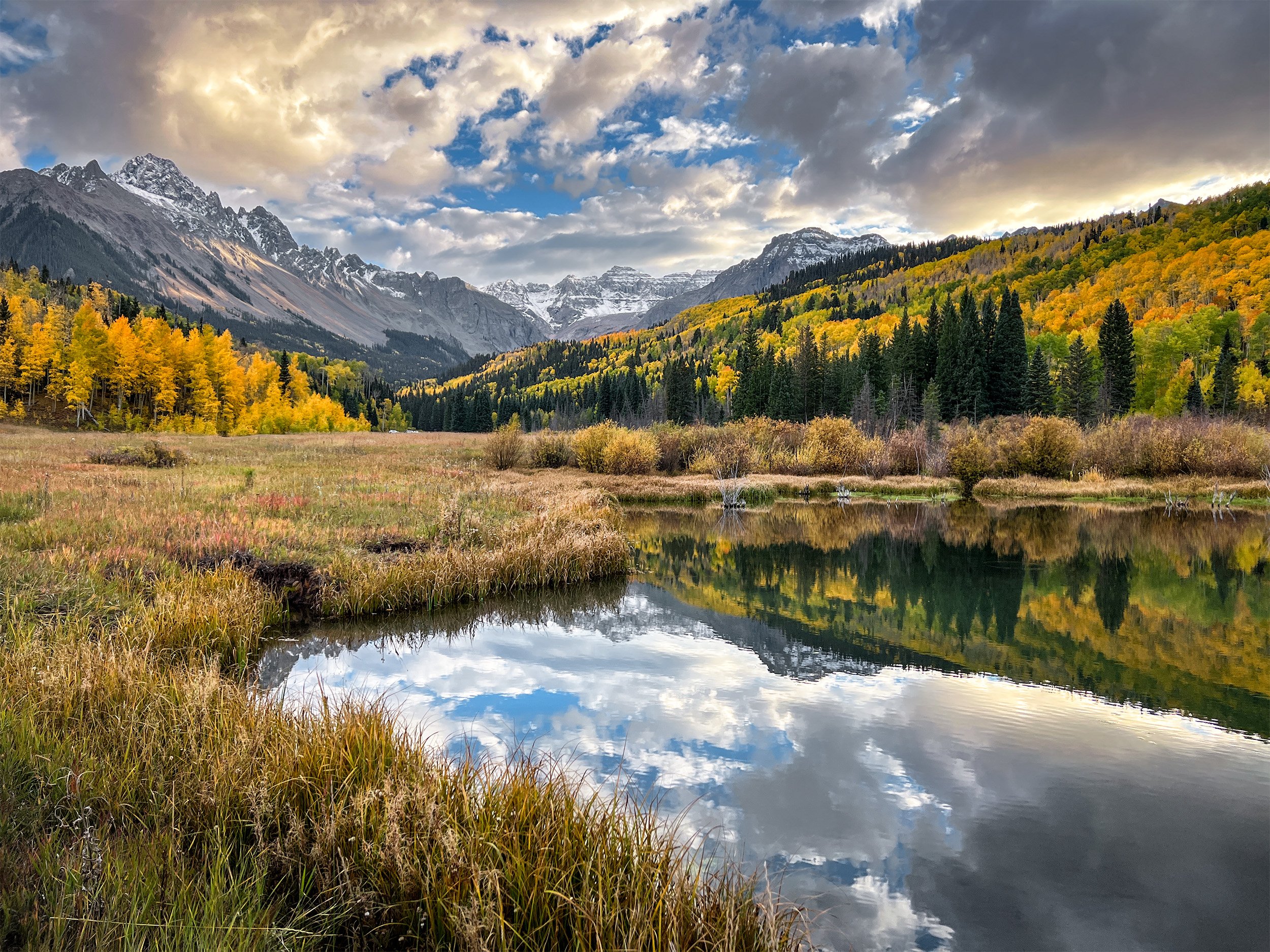 San Juan Mountains in fall near lake.