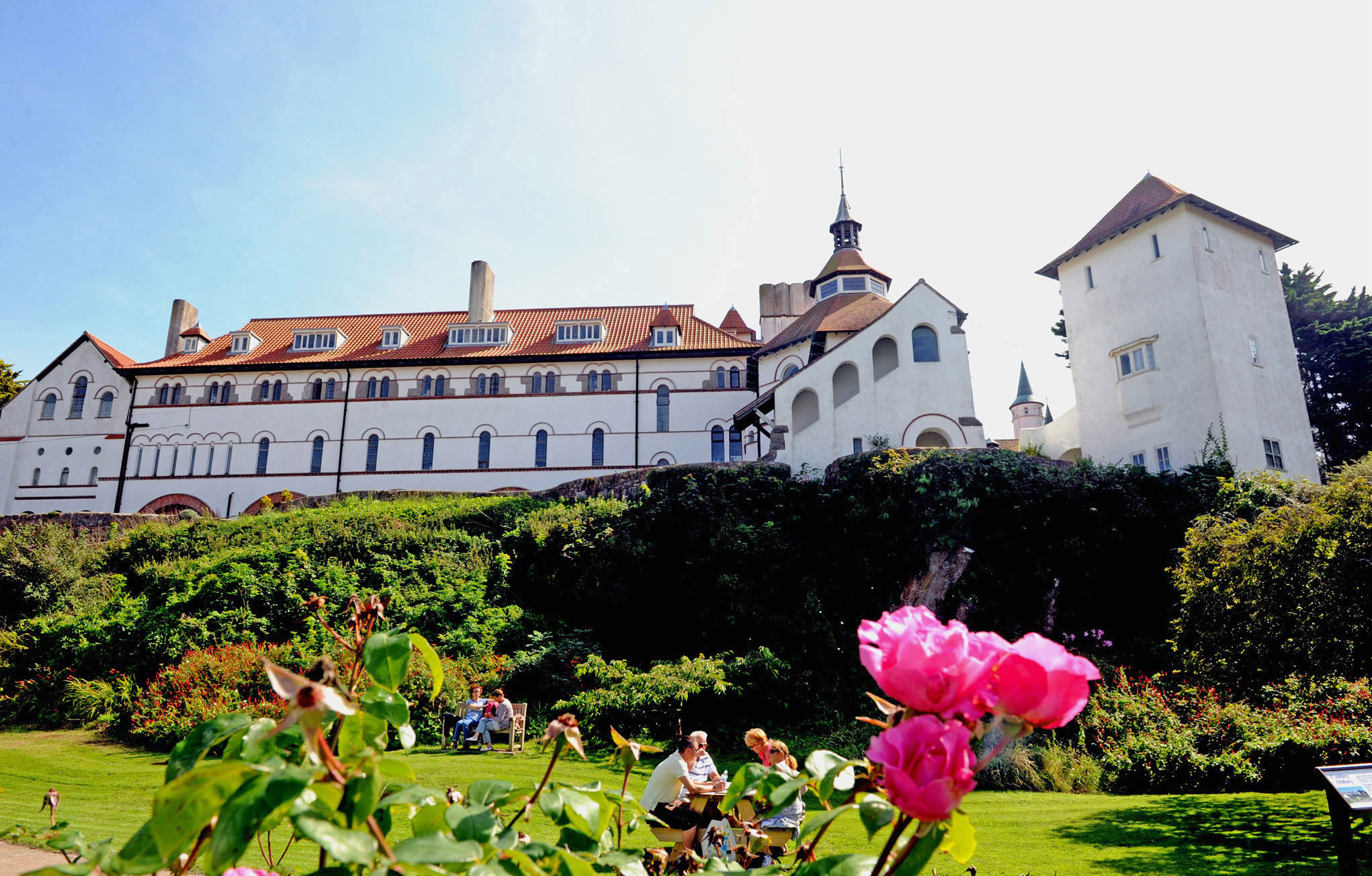 Caldey Abbey and pink roses.jpg