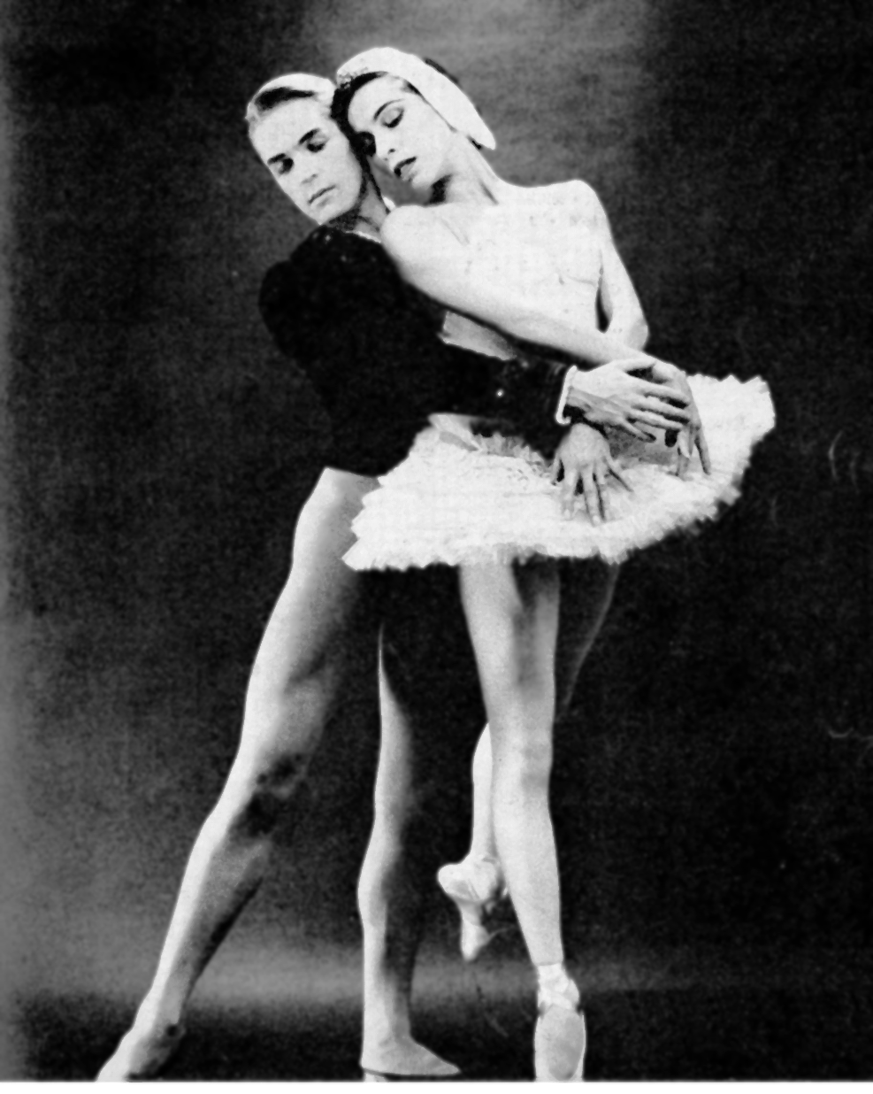 Erik Bruhn, a thin white man wearing a black leotard, dancing with Maria Tallchief. a thin Indigenous woman wearing a white tutu.