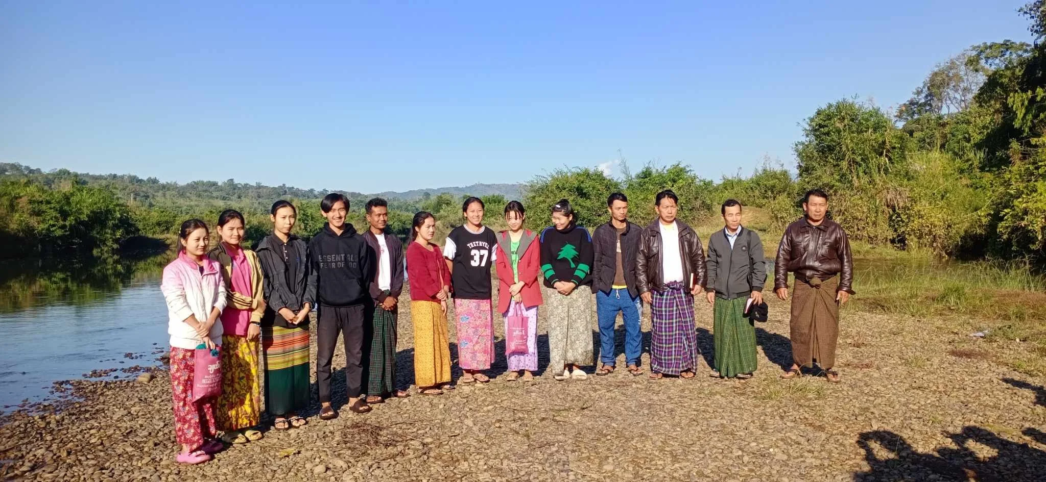 13 newly baptized Christians, discipled by Jay Khi