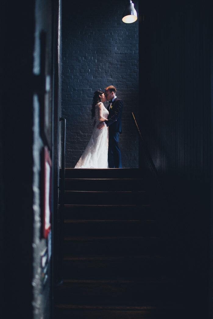 Wedding couple poses in Chateau Saint-Ambroise