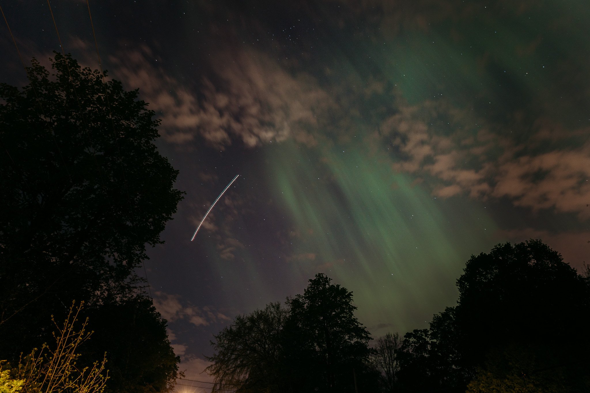  Down the street facing west towards Dorion. I caught a plane in the 15 second exposure, and wondered if people in the plane could see the lights and how that looked to them. 