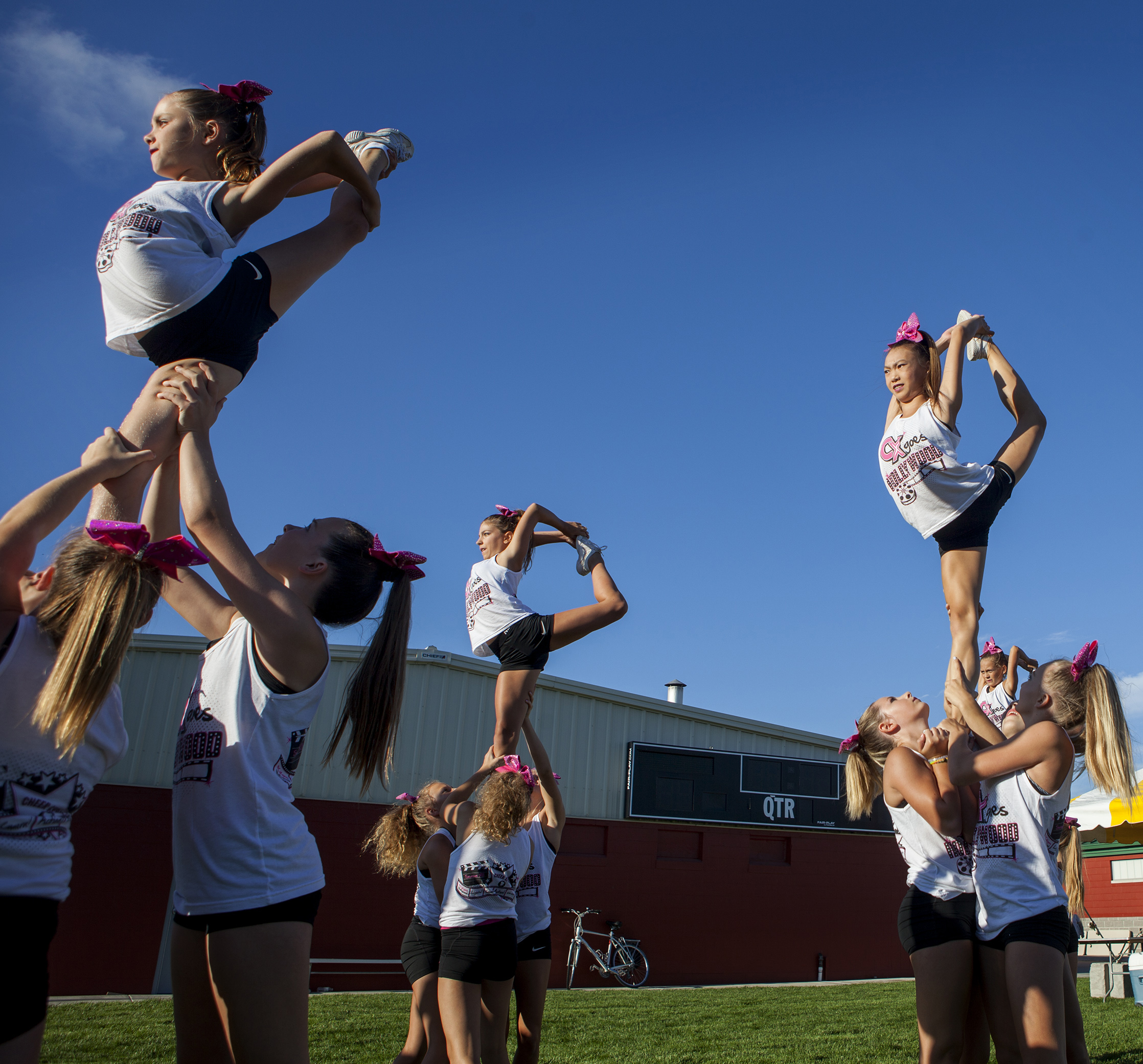  Cheer Xpress members, ages 9-15, practice their routine before the opening ceremonies of the Cornhusker State Games on July 15, 2016, at Seacrest Field in Lincoln, Neb. 
