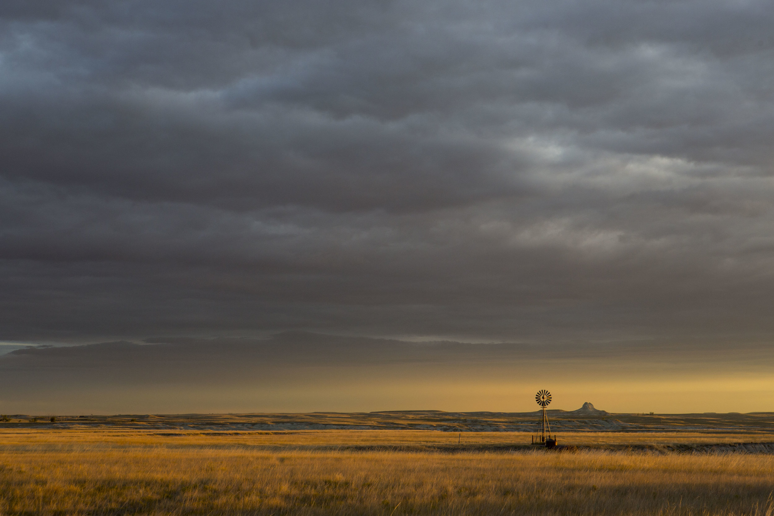  A lone windmill stands in the prairie grass at Toadstool Geologic Park at the Oglala National Grassland in Sioux County, Neb. 